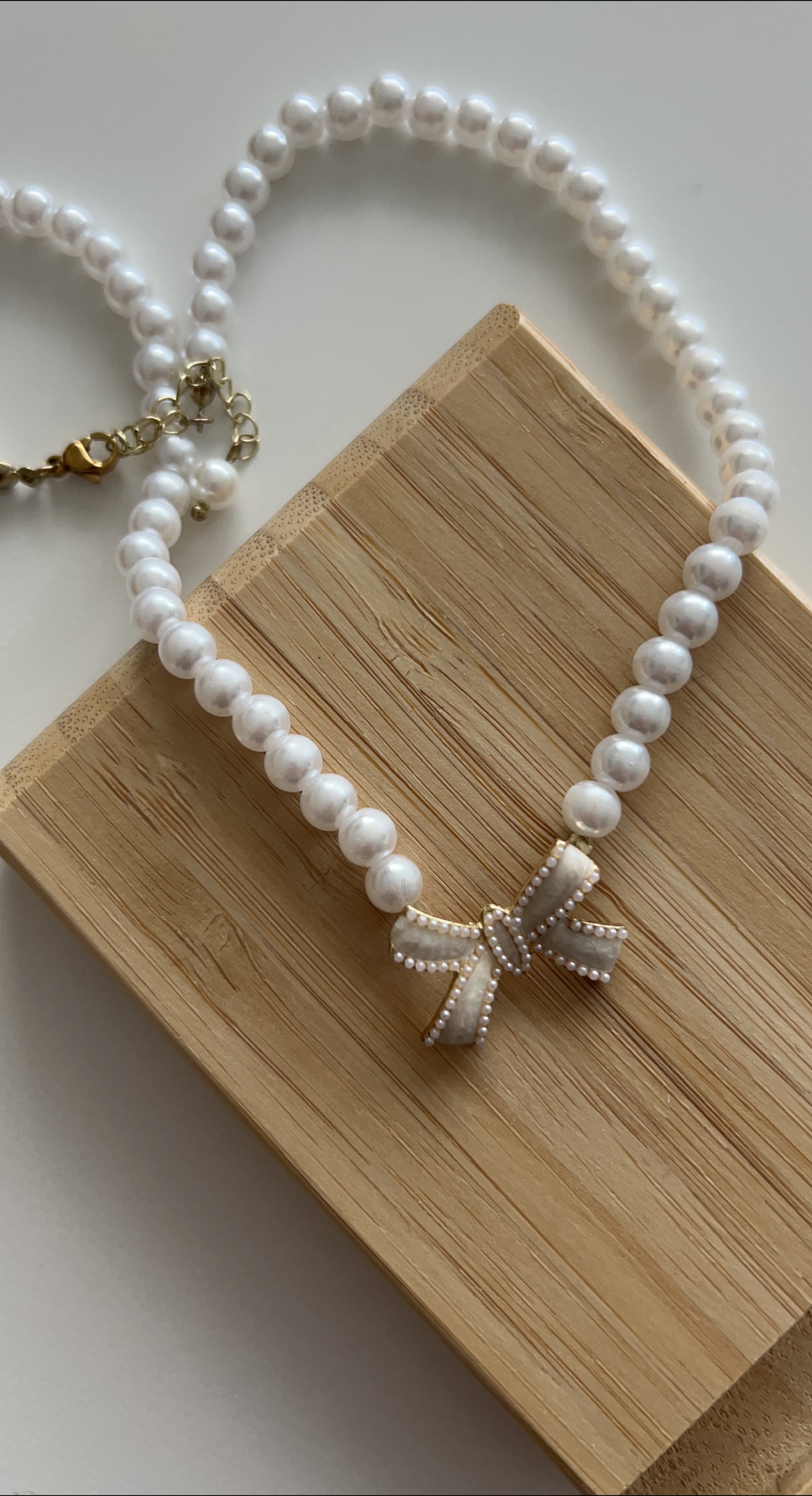 Pearl Necklace with Bow Charm thumbnail