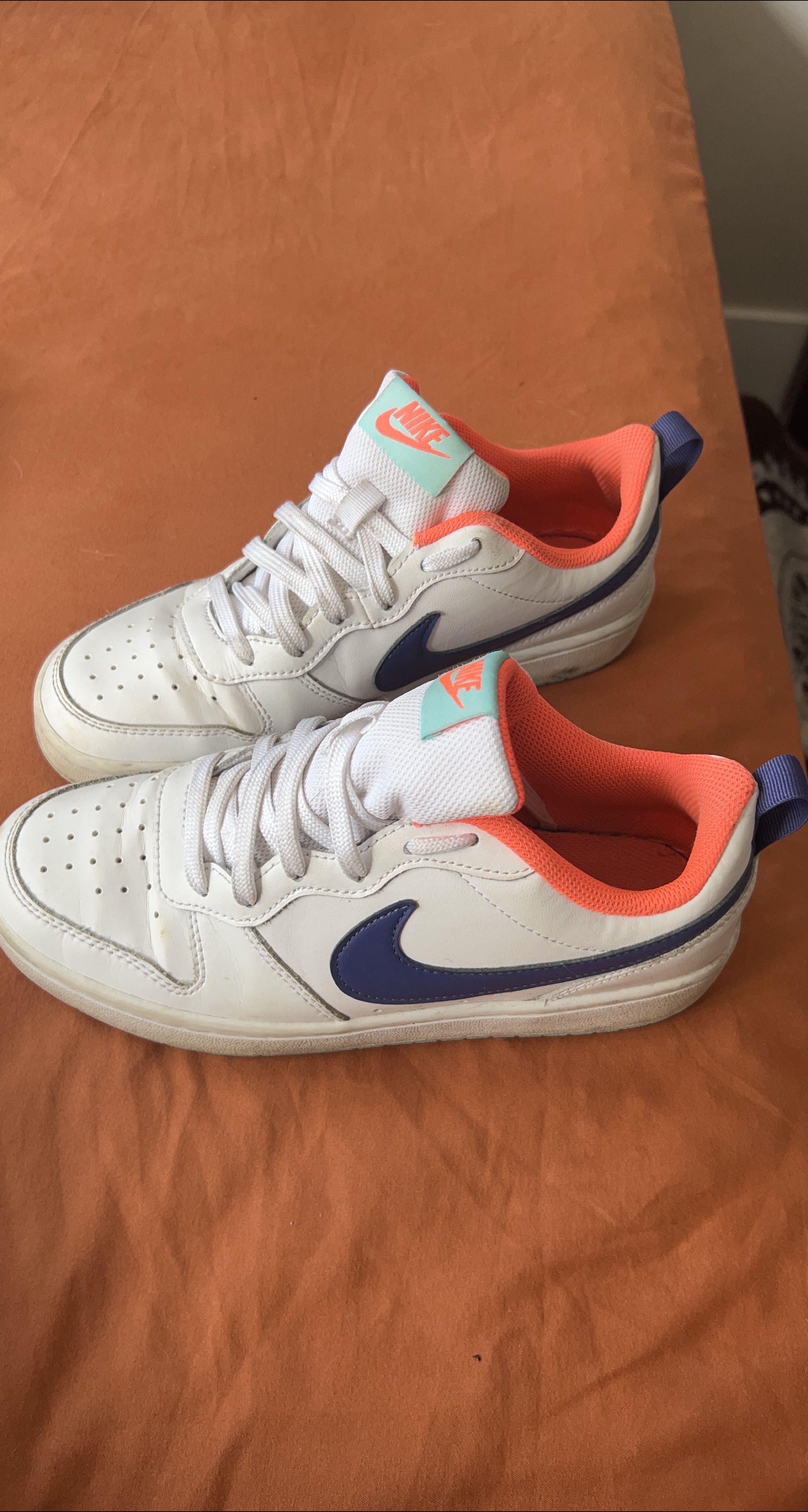 White and blue Nike sneakers thumbnail