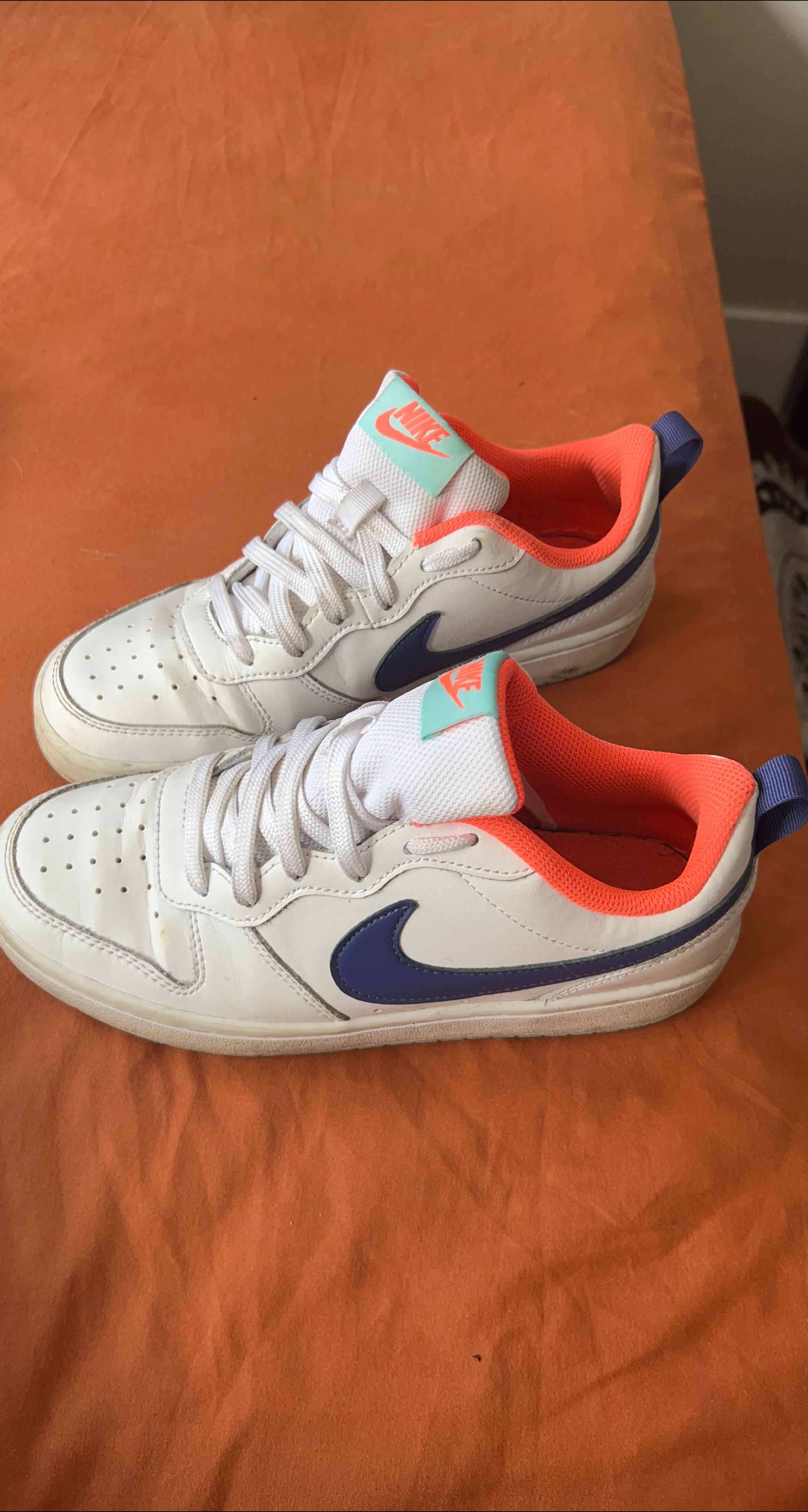 White and blue Nike sneakers