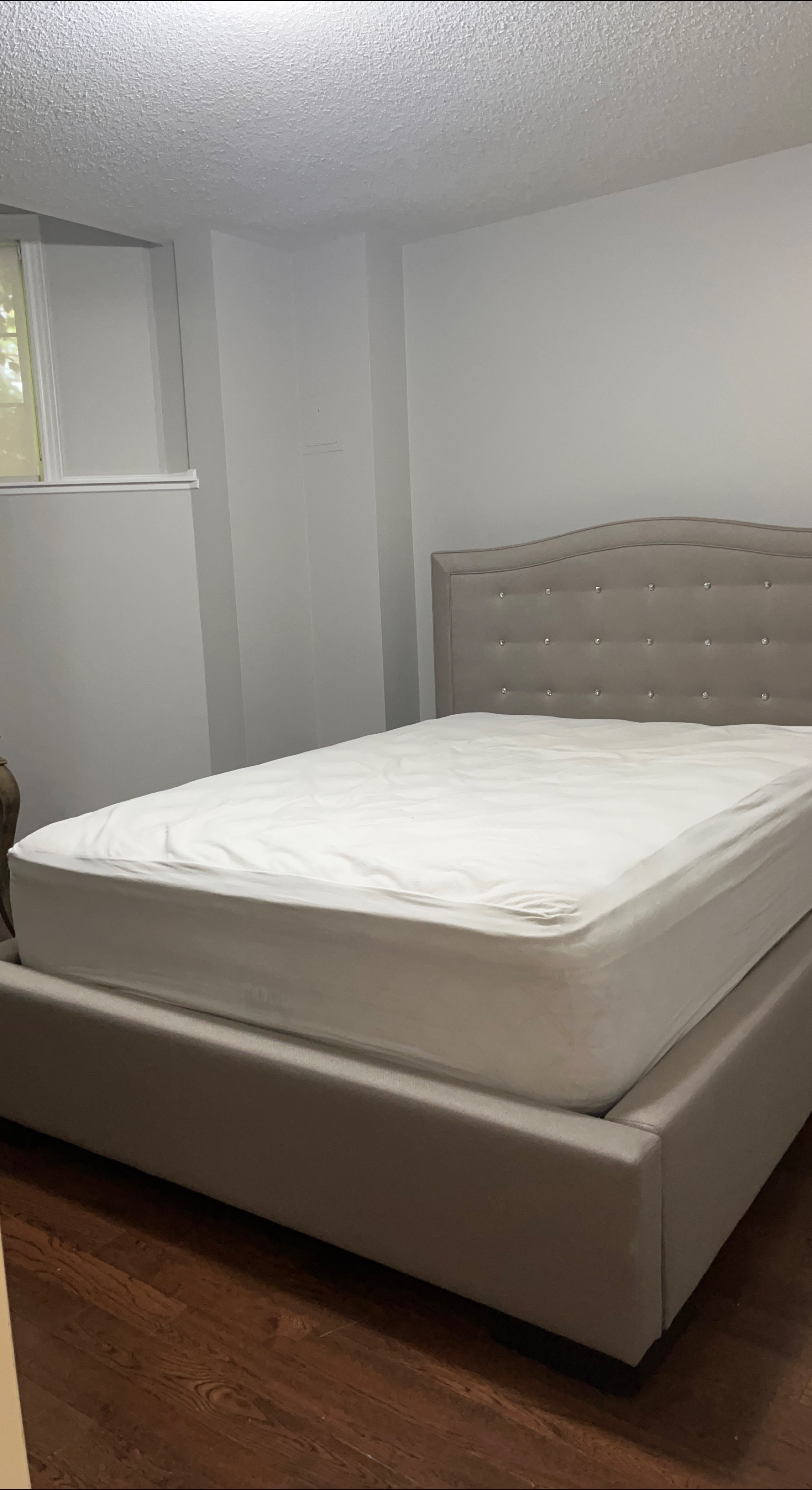 Upholstered queen size bed with storage space