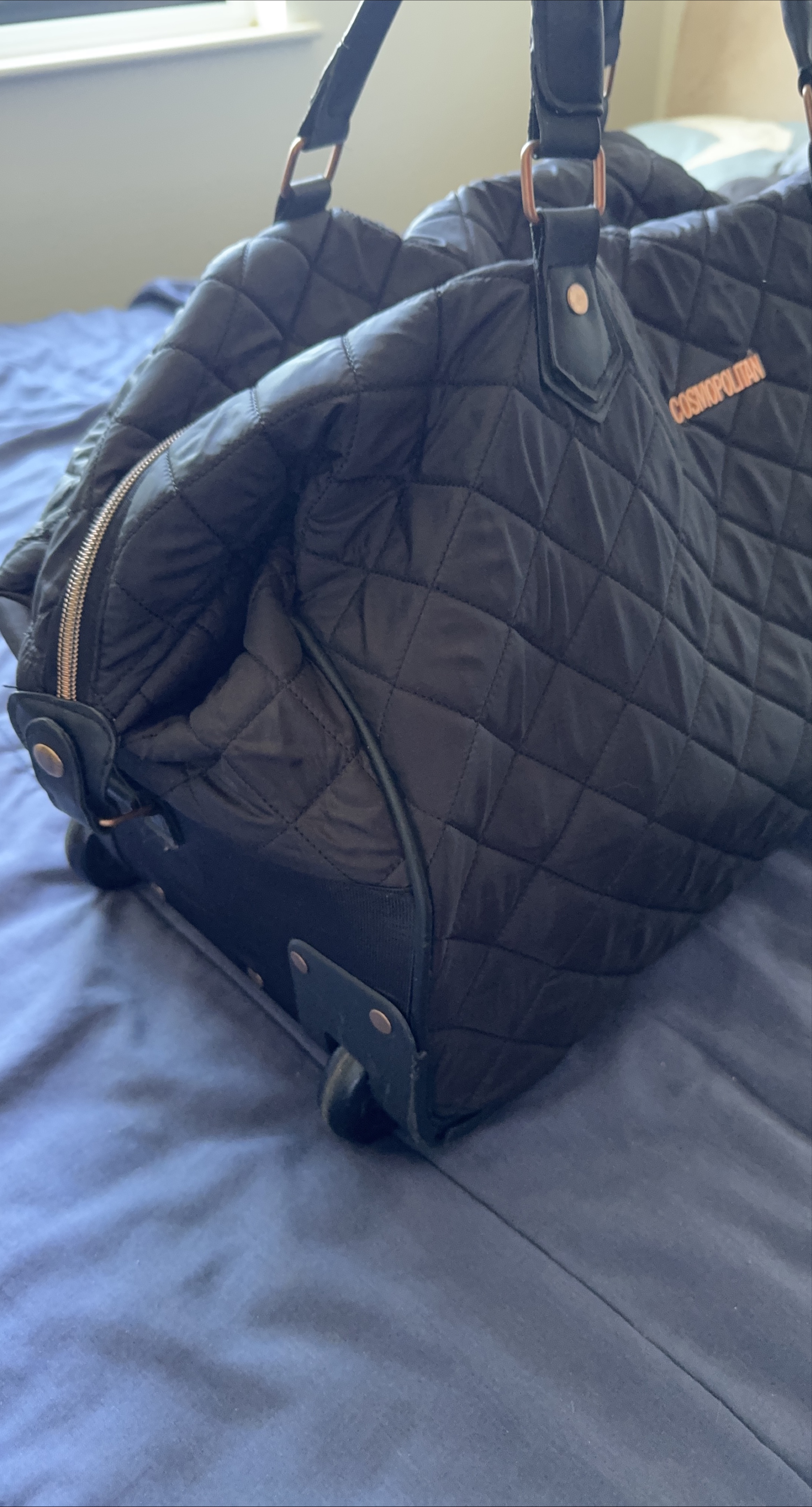 Cosmopolitan Quilted Rolling Duffel Bag
