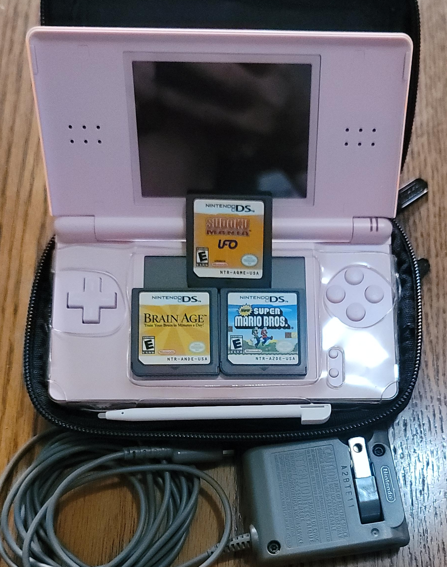 Pink Nintendo DS with Games and Accessories thumbnail