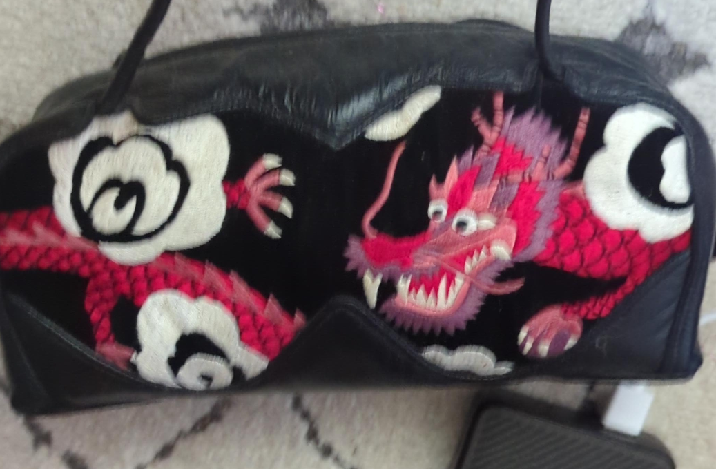 Black leather handbag with dragon embroidery