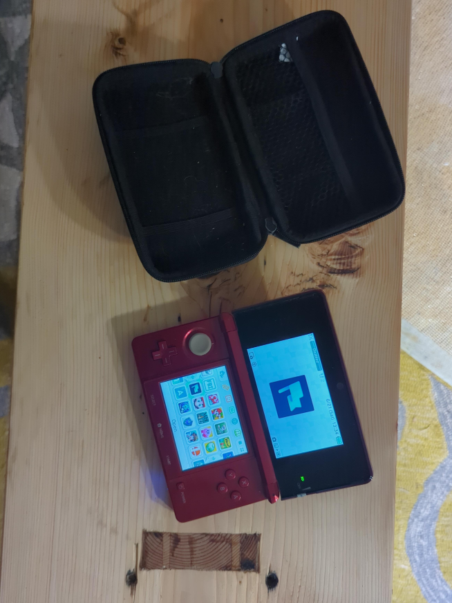 Red Nintendo 3DS with Case