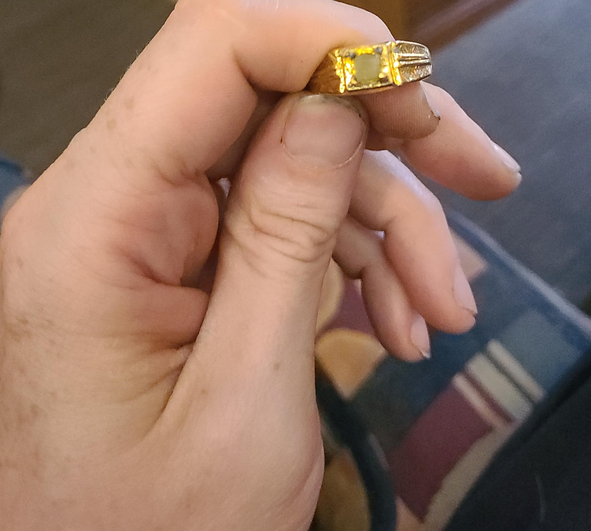Gold ring with a large, square gem thumbnail