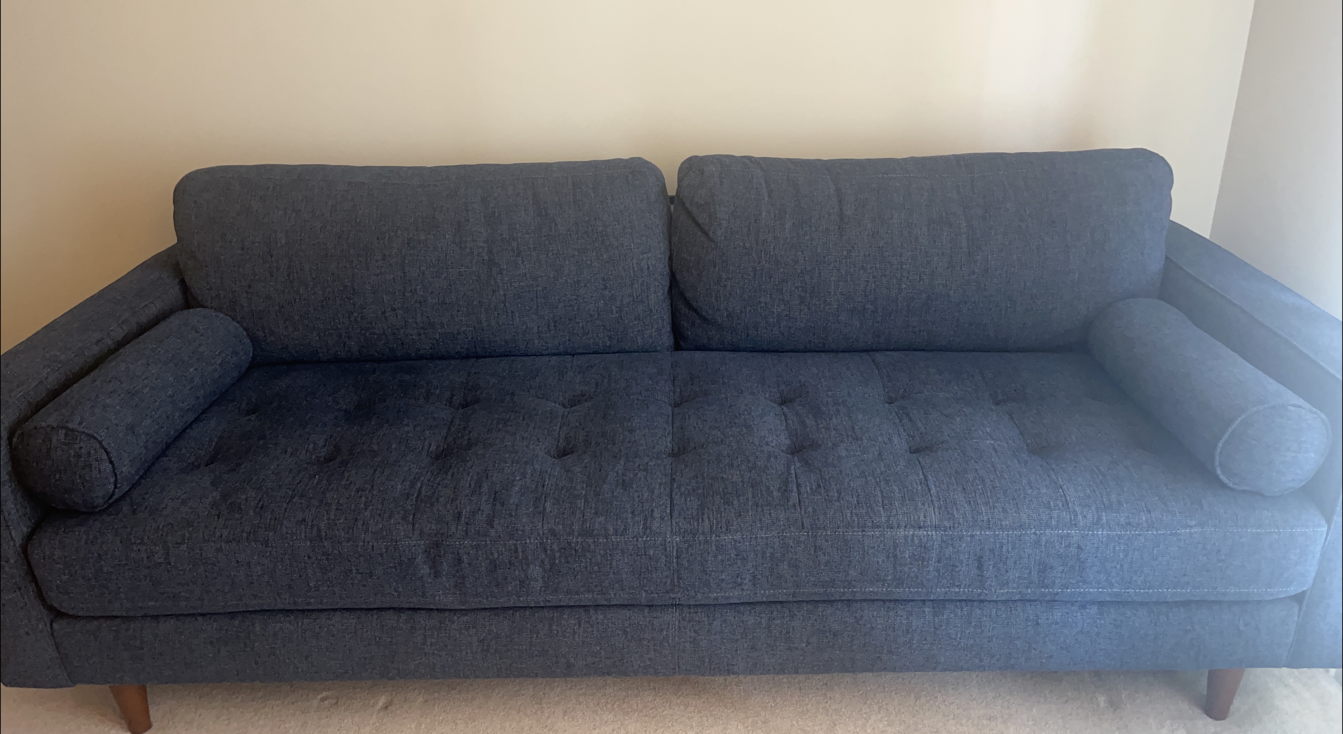 Blue Sofa with Bolster Pillows