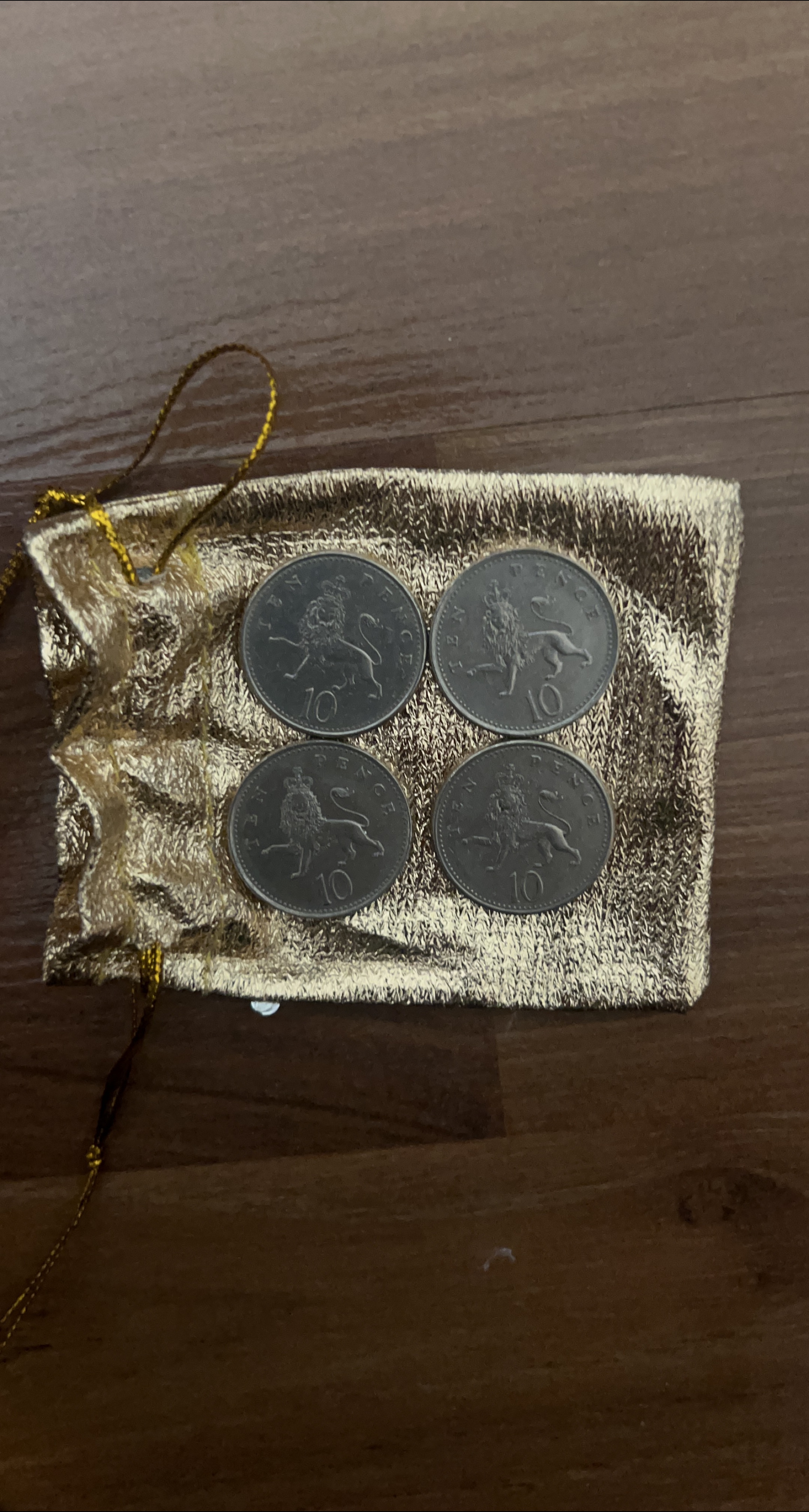 Four 10 Pence Coins in Gold Pouch thumbnail
