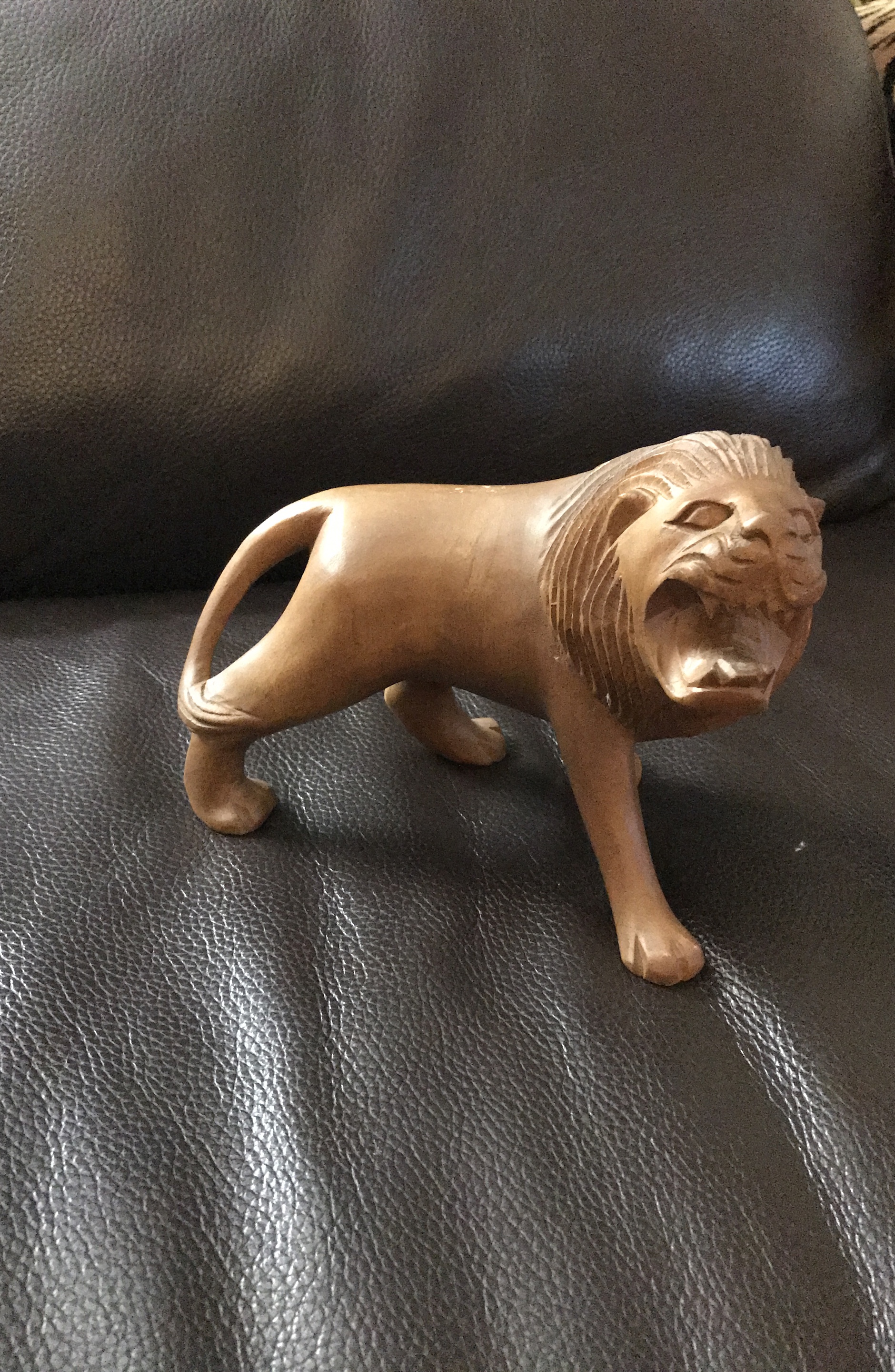 Handcrafted wooden lion figurine