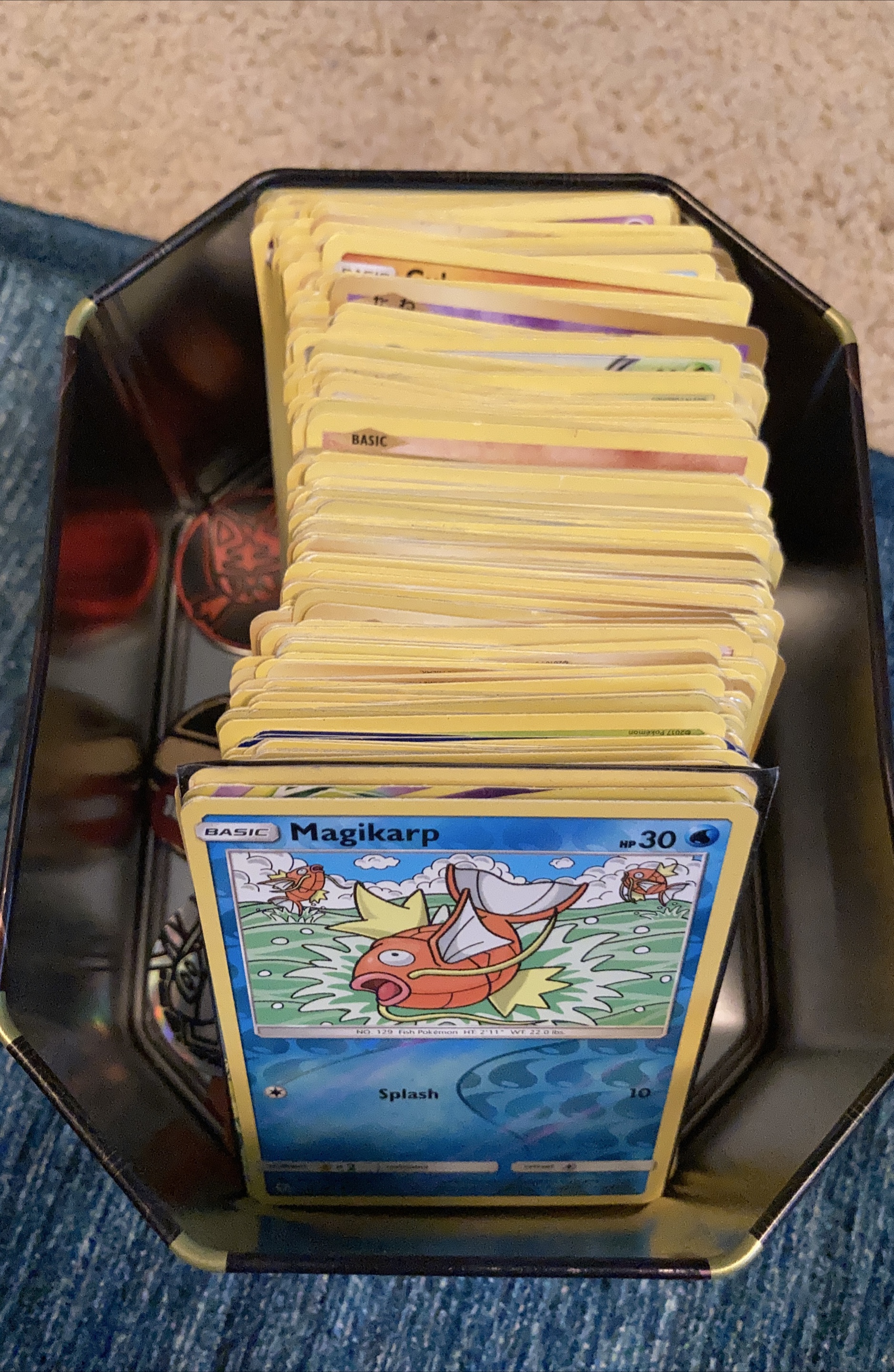 Tin of 246 Pokémon cards includes reverse holos and holos. thumbnail