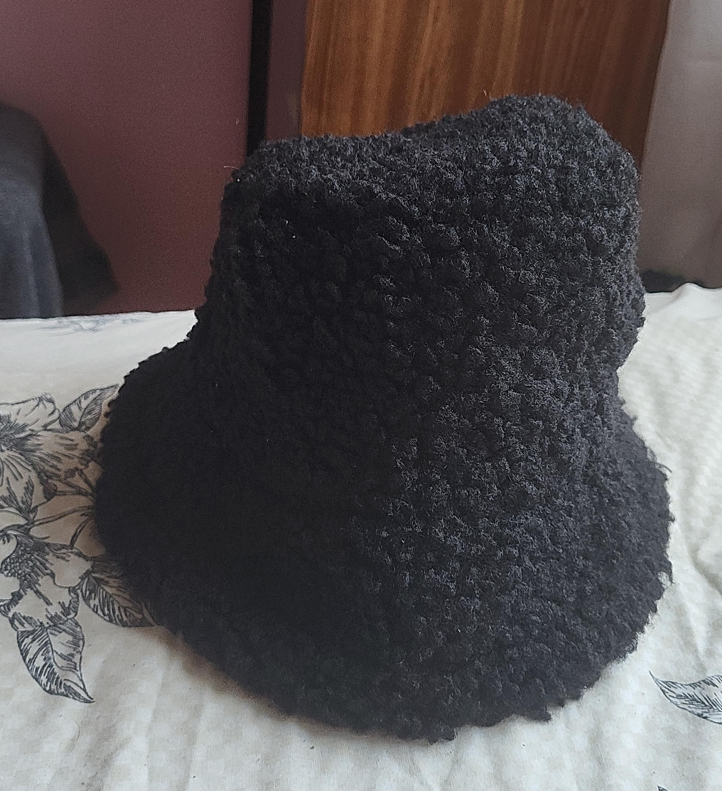 Black furry hat thumbnail