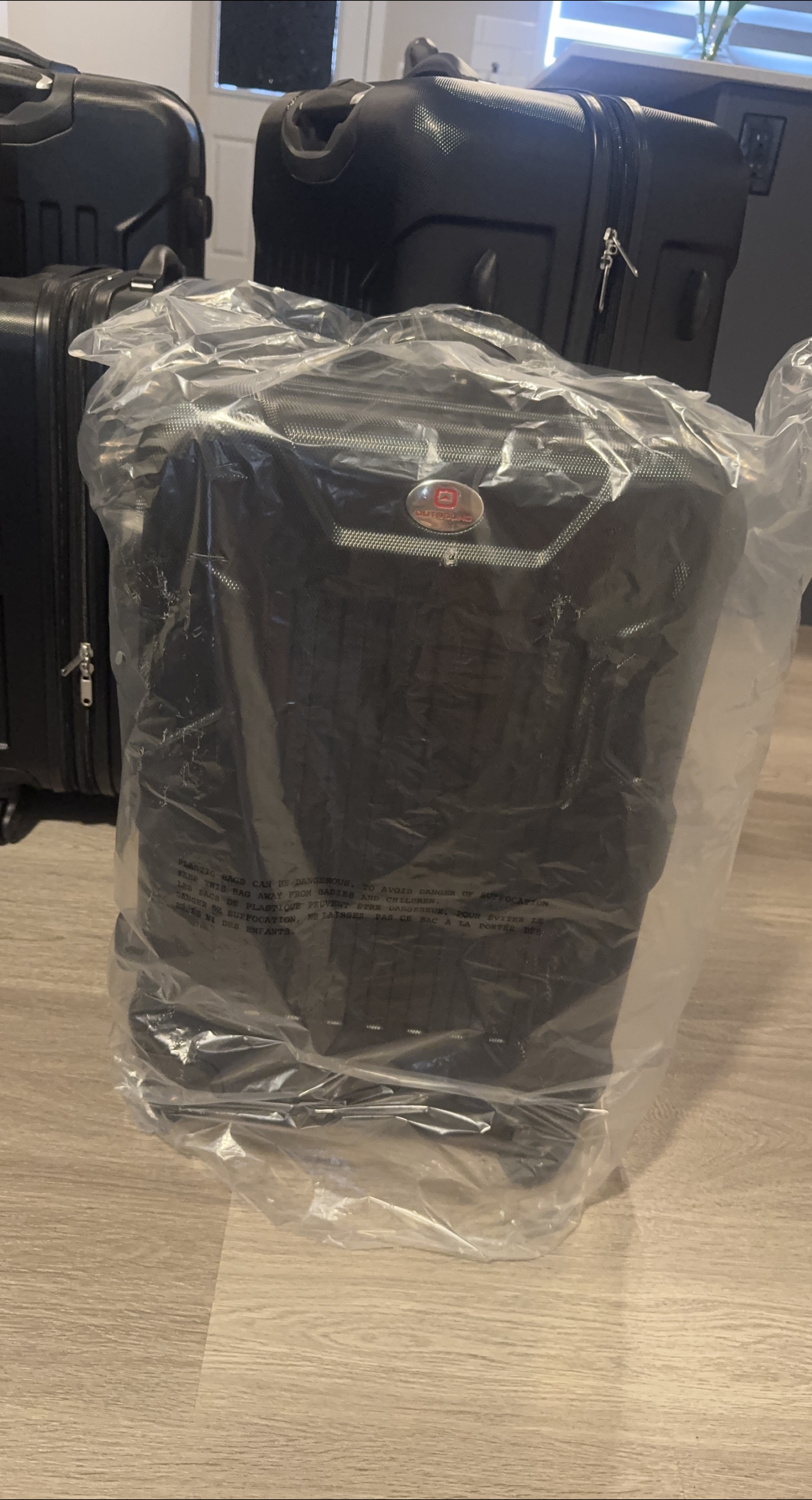 Outbound Black Luggage - New in Plastic thumbnail