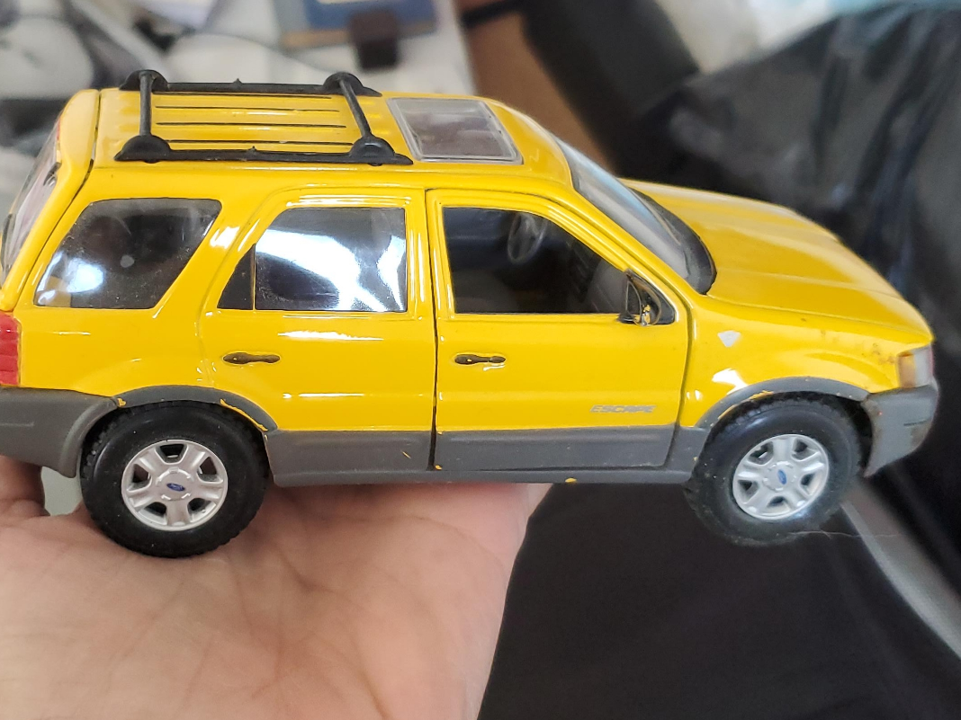 Maisto Ford Escape Yellow Diecast Model Car thumbnail