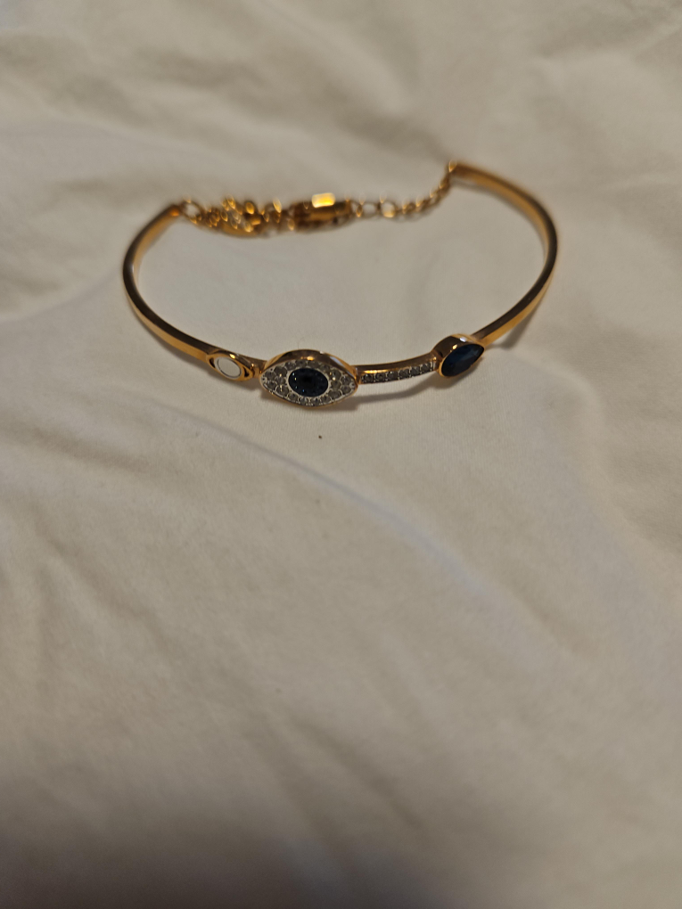 Gold-tone Bangle Bracelet with Dark Blue Stones thumbnail