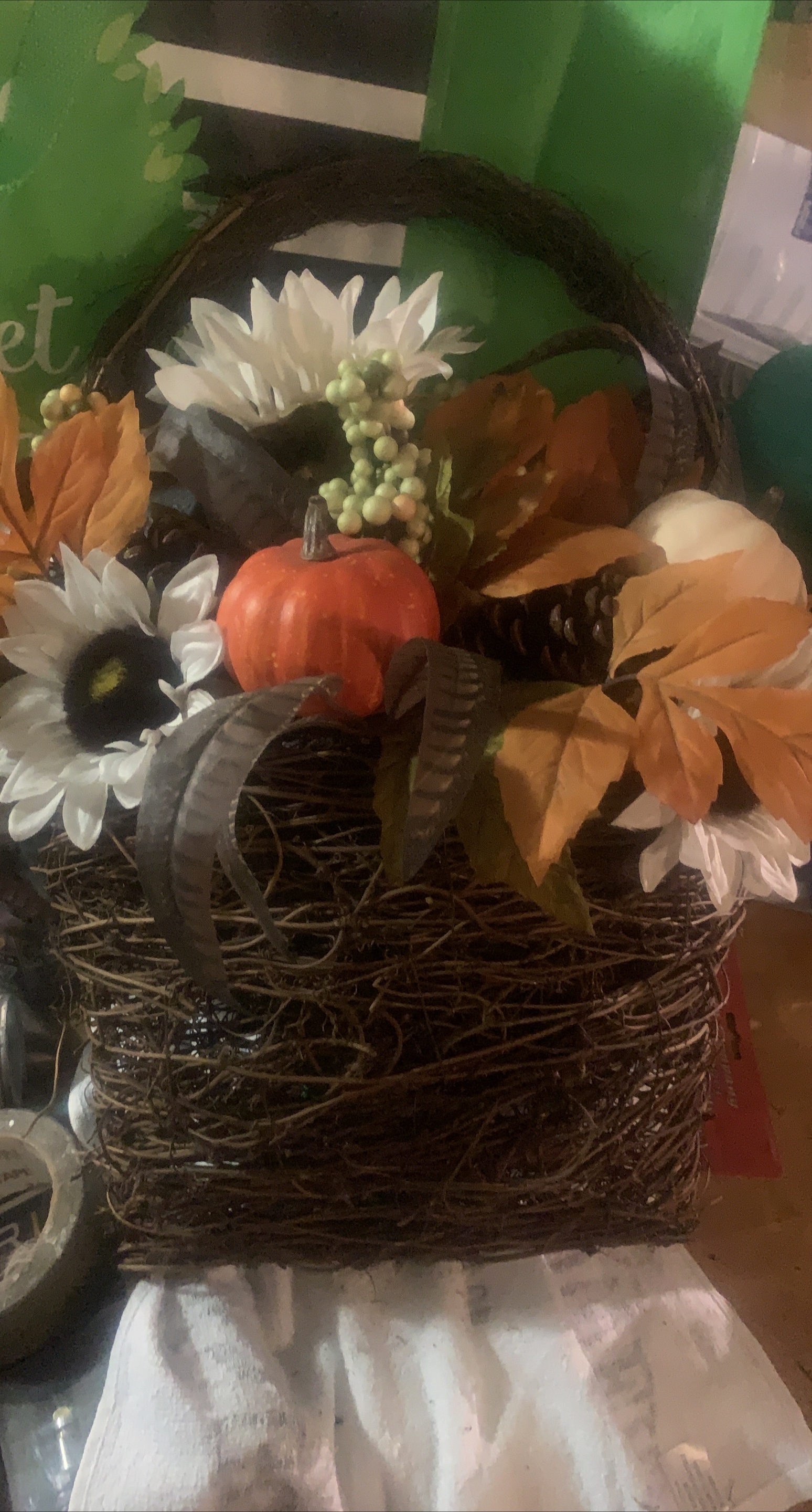 Fall floral arrangement in wicker basket thumbnail