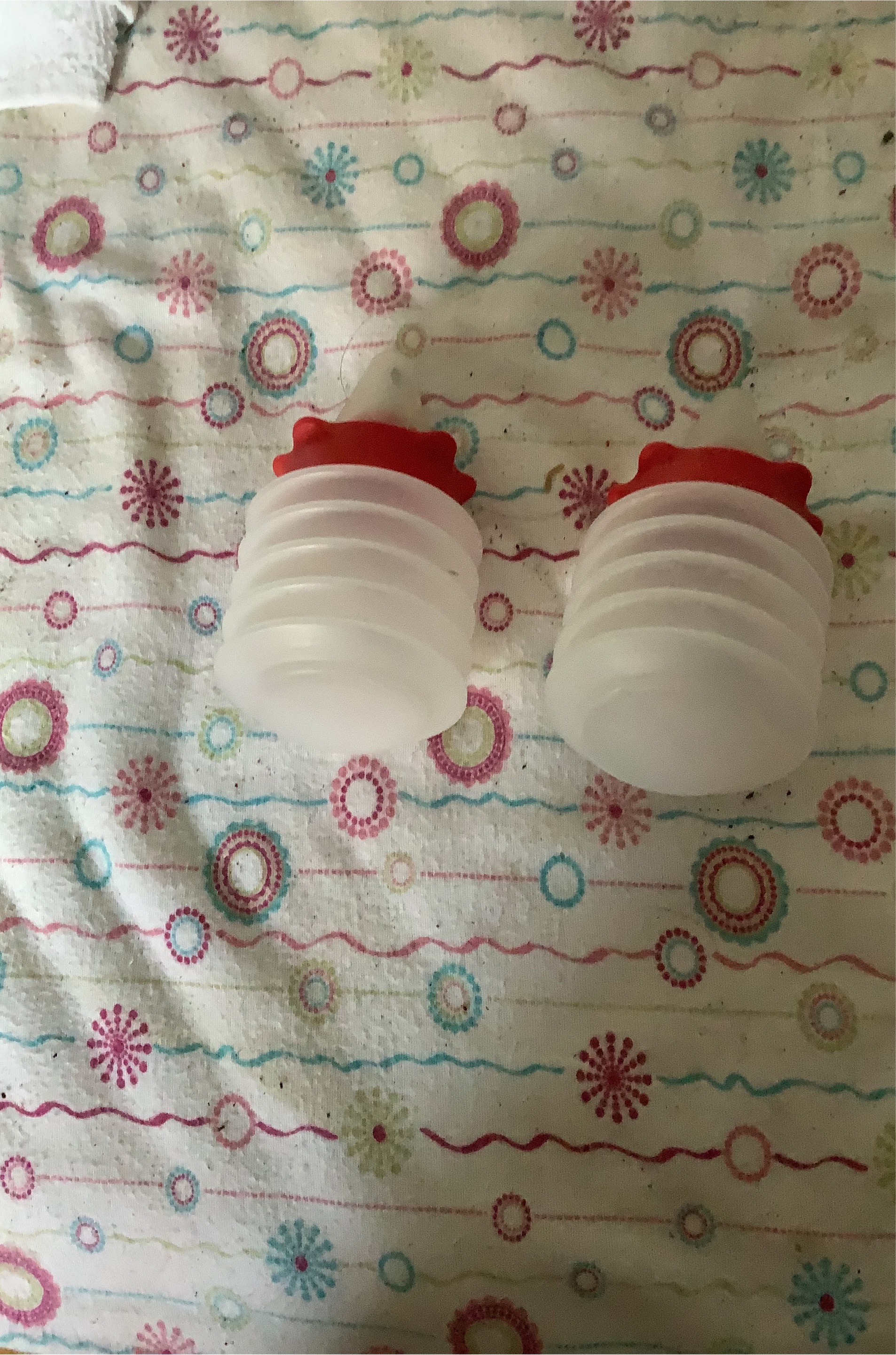 Two White Bottles with Red Caps thumbnail