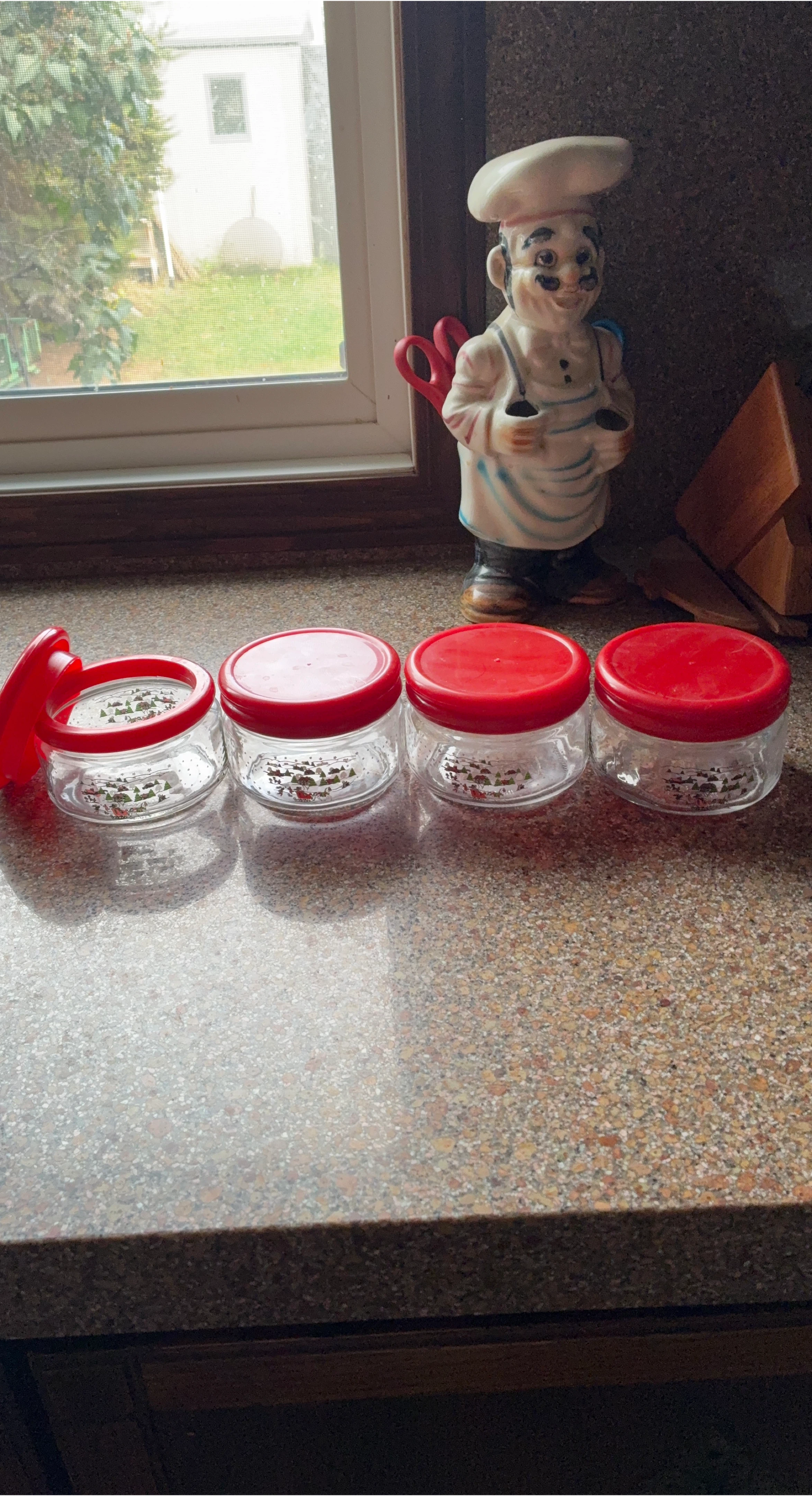 Four Glass Jars with Red Lids