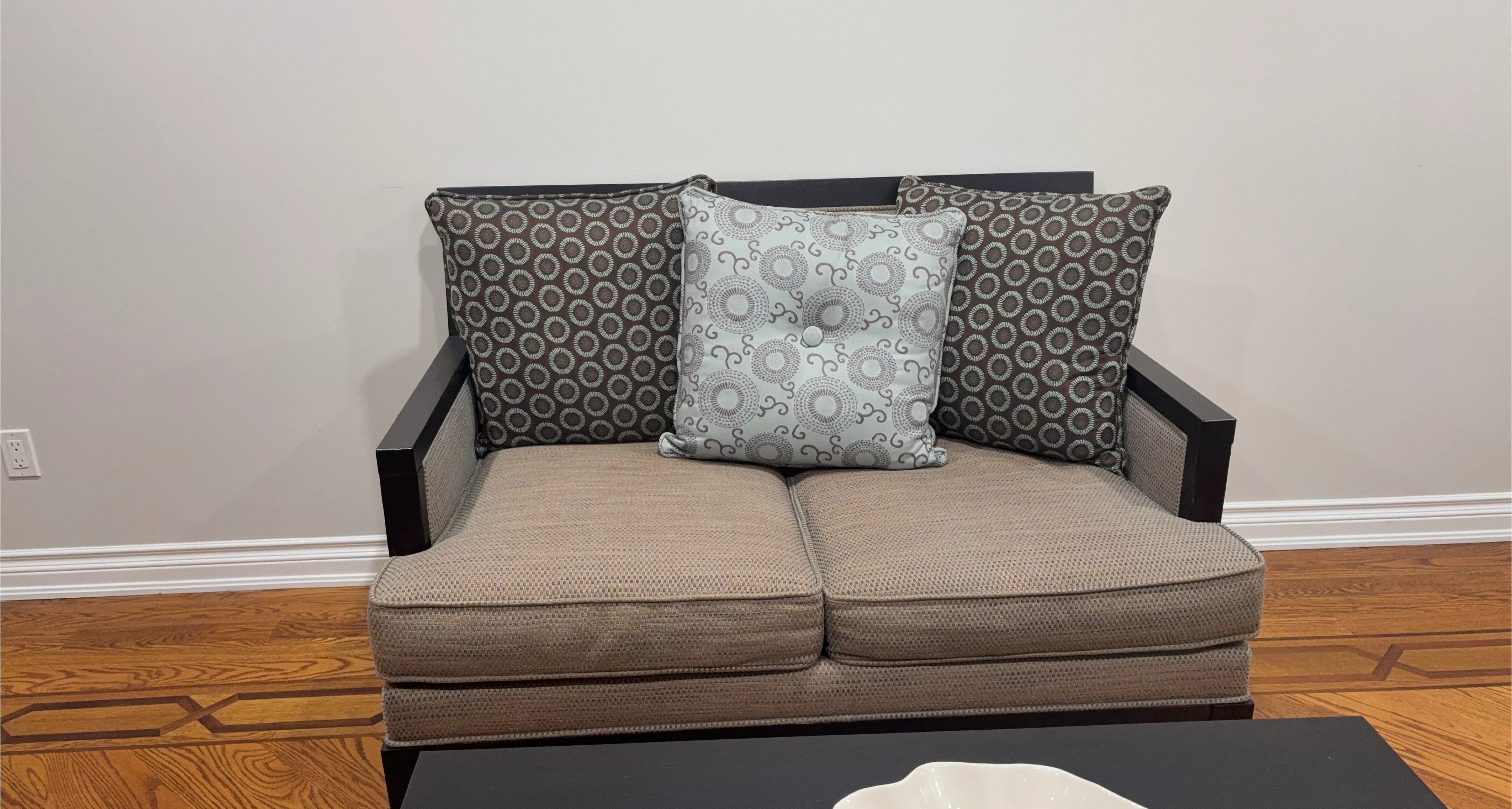 Loveseat with patterned pillows thumbnail