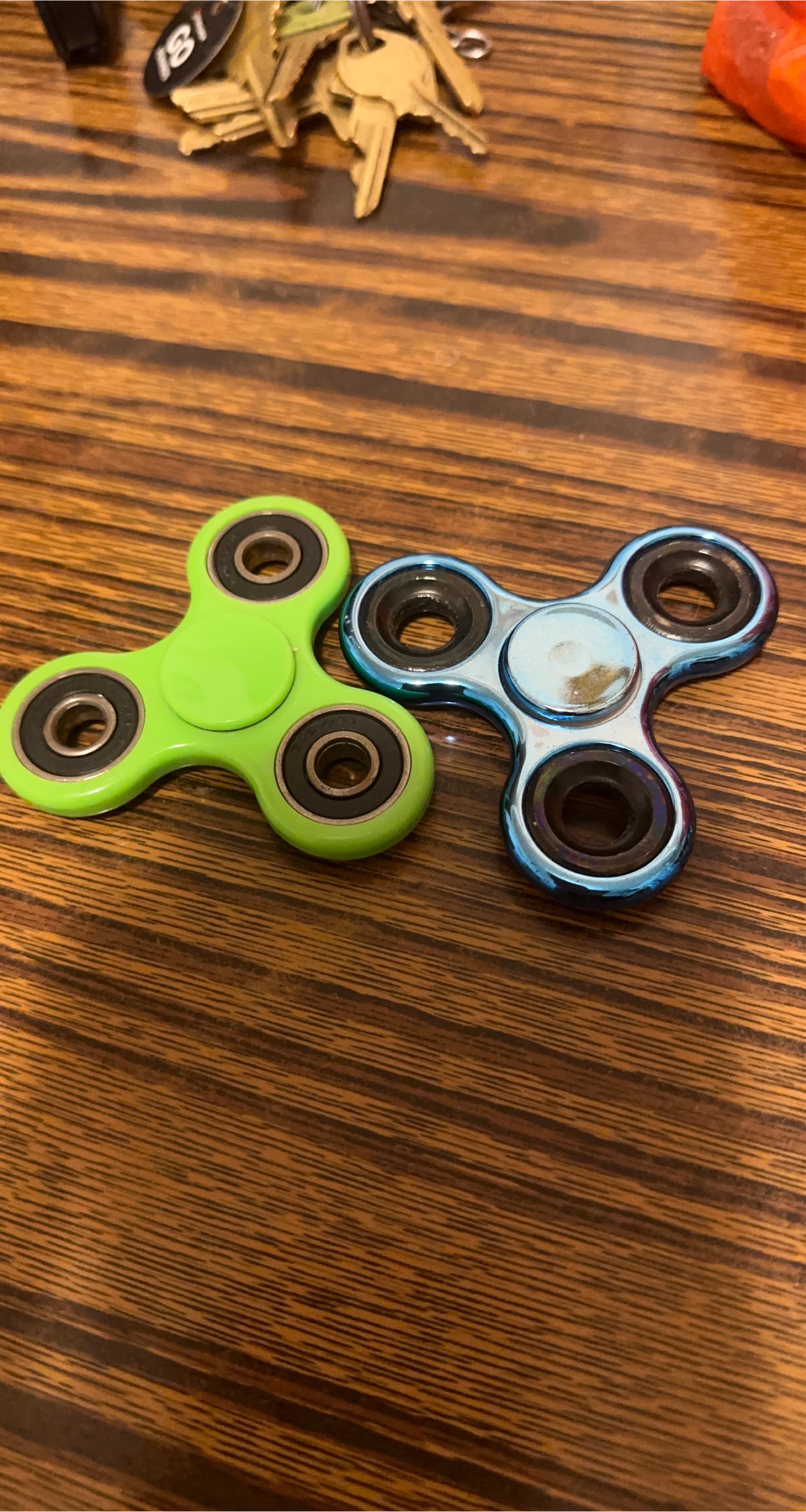 Two Fidget Spinners - Green and Blue thumbnail