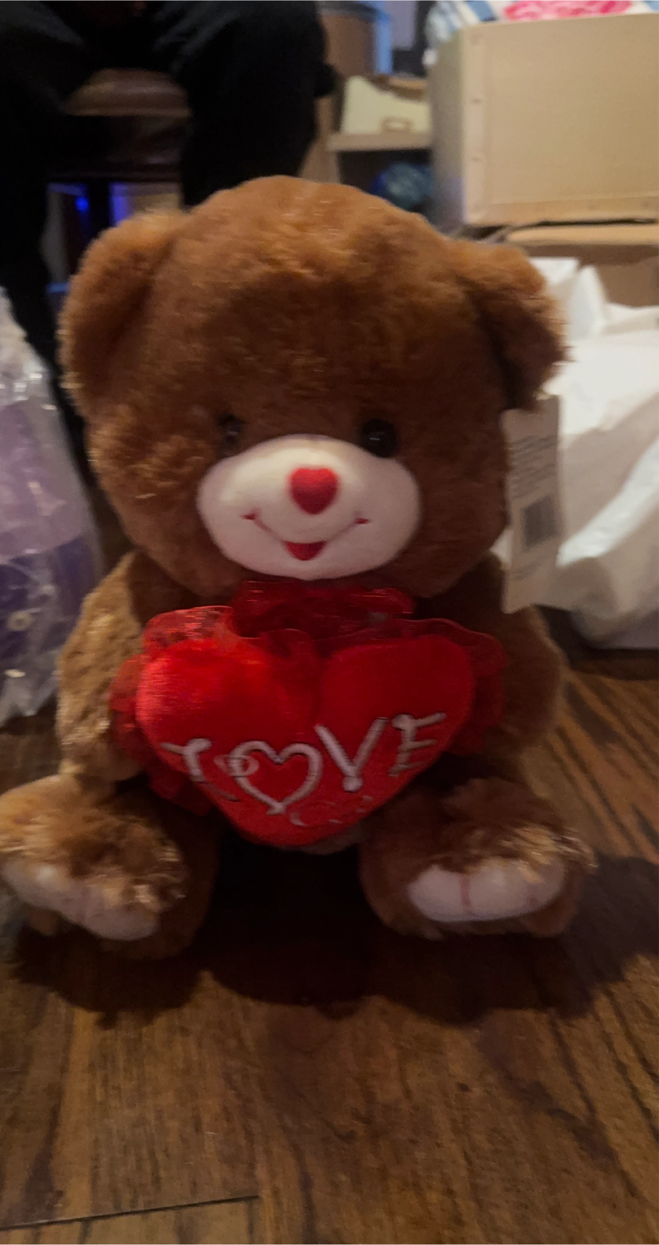 Teddy bear holding love heart thumbnail