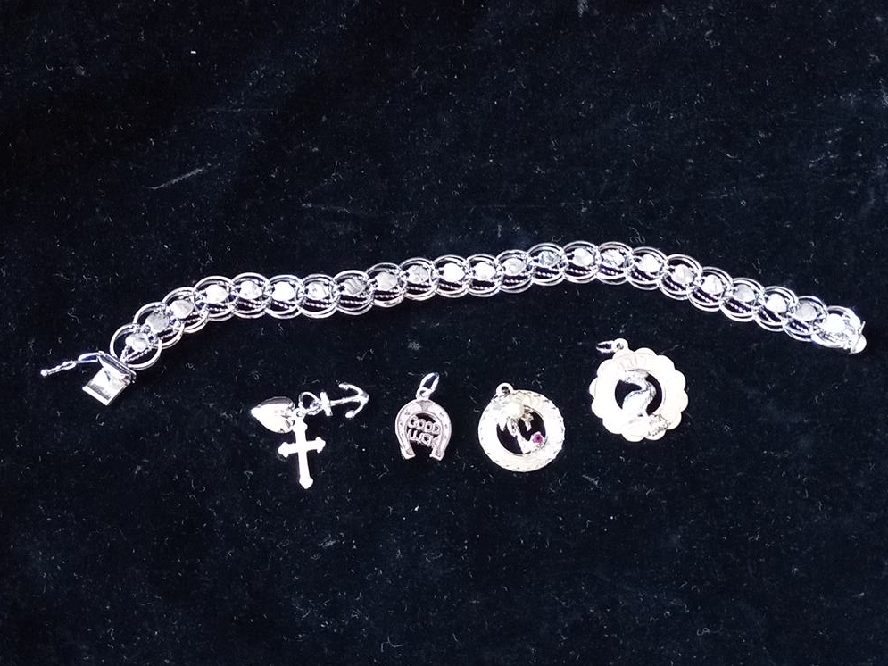 Silver-tone charm bracelet with 4 charms