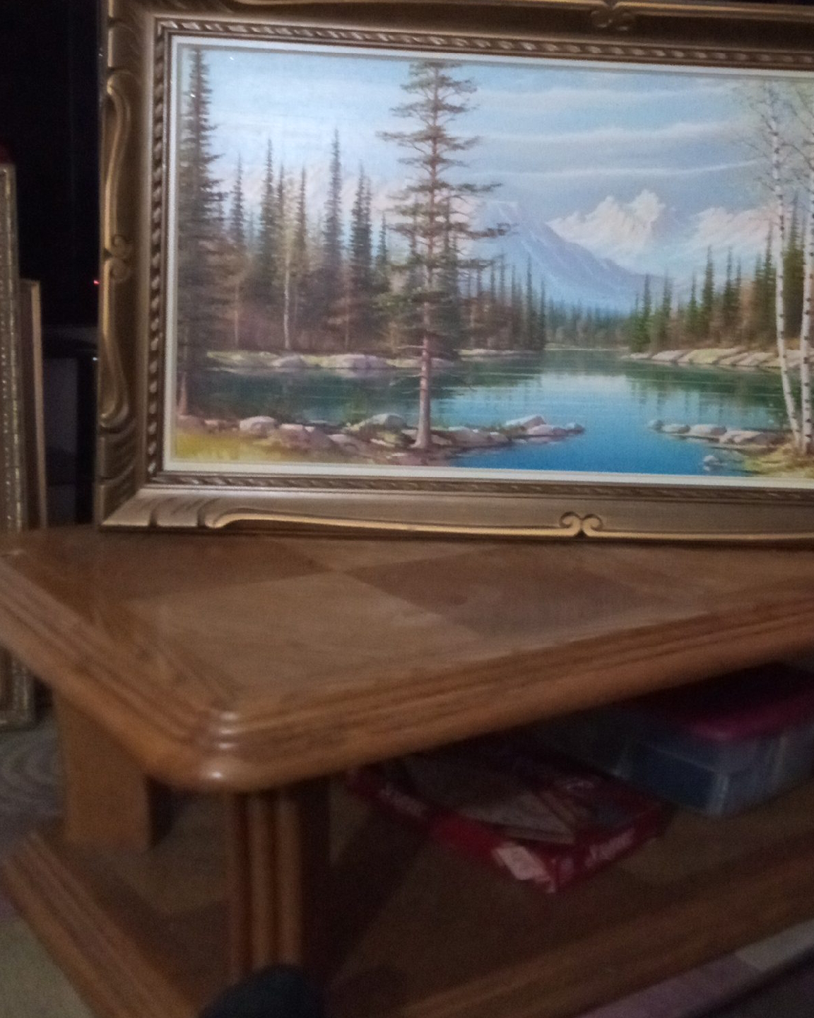 Landscape painting in ornate gold frame
