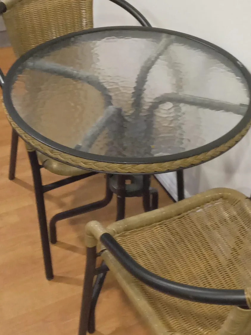 Round Glass Top Patio Table with Two Wicker Chairs
