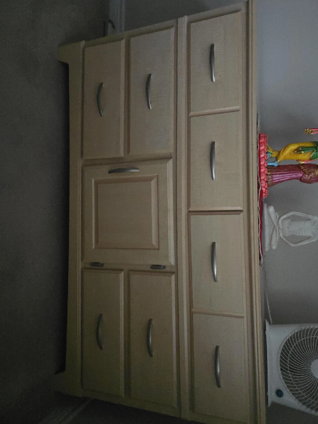 Light Wood Storage Cabinet with Multiple Drawers and Doors