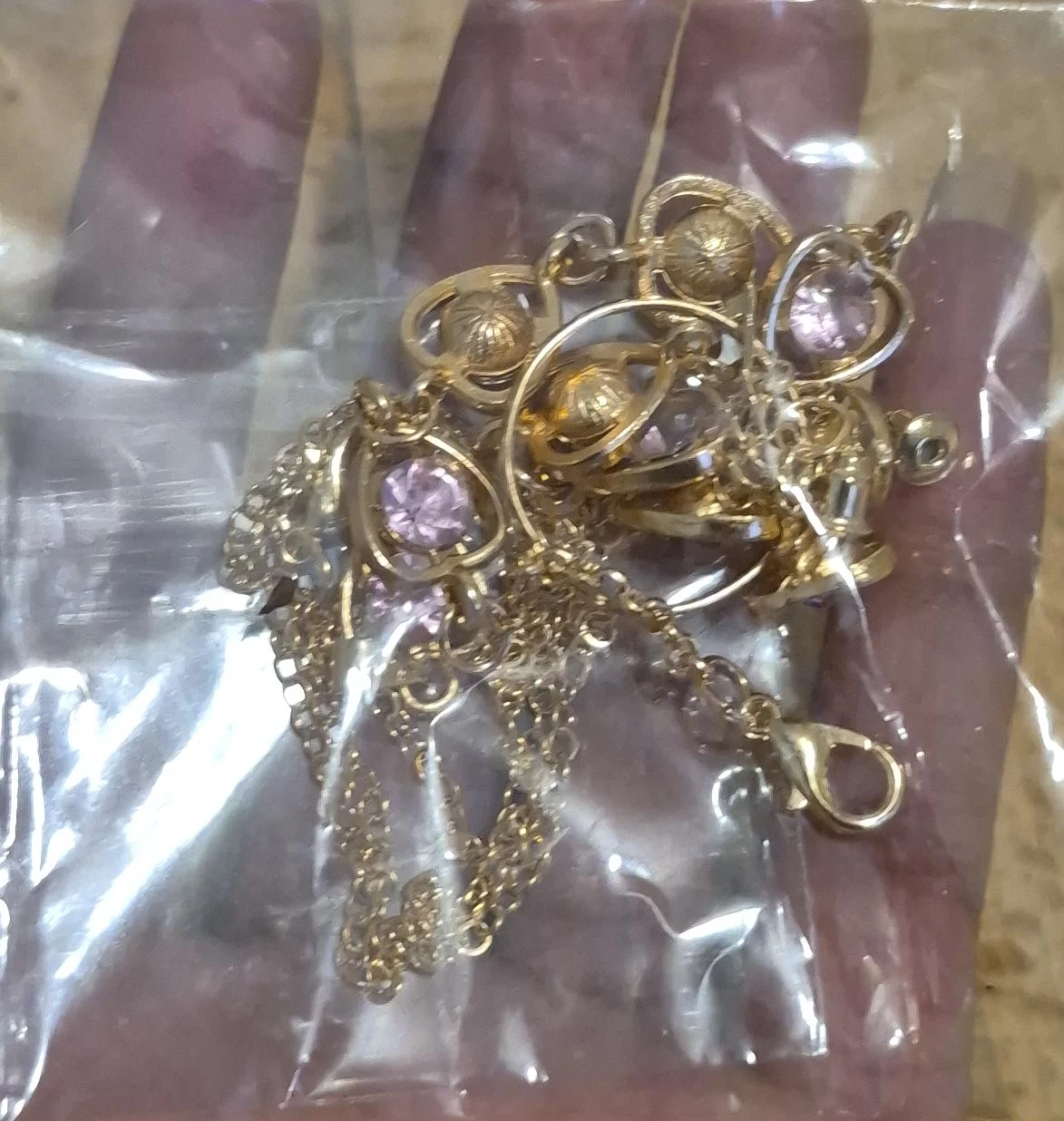 Gold-tone necklace with purple stones