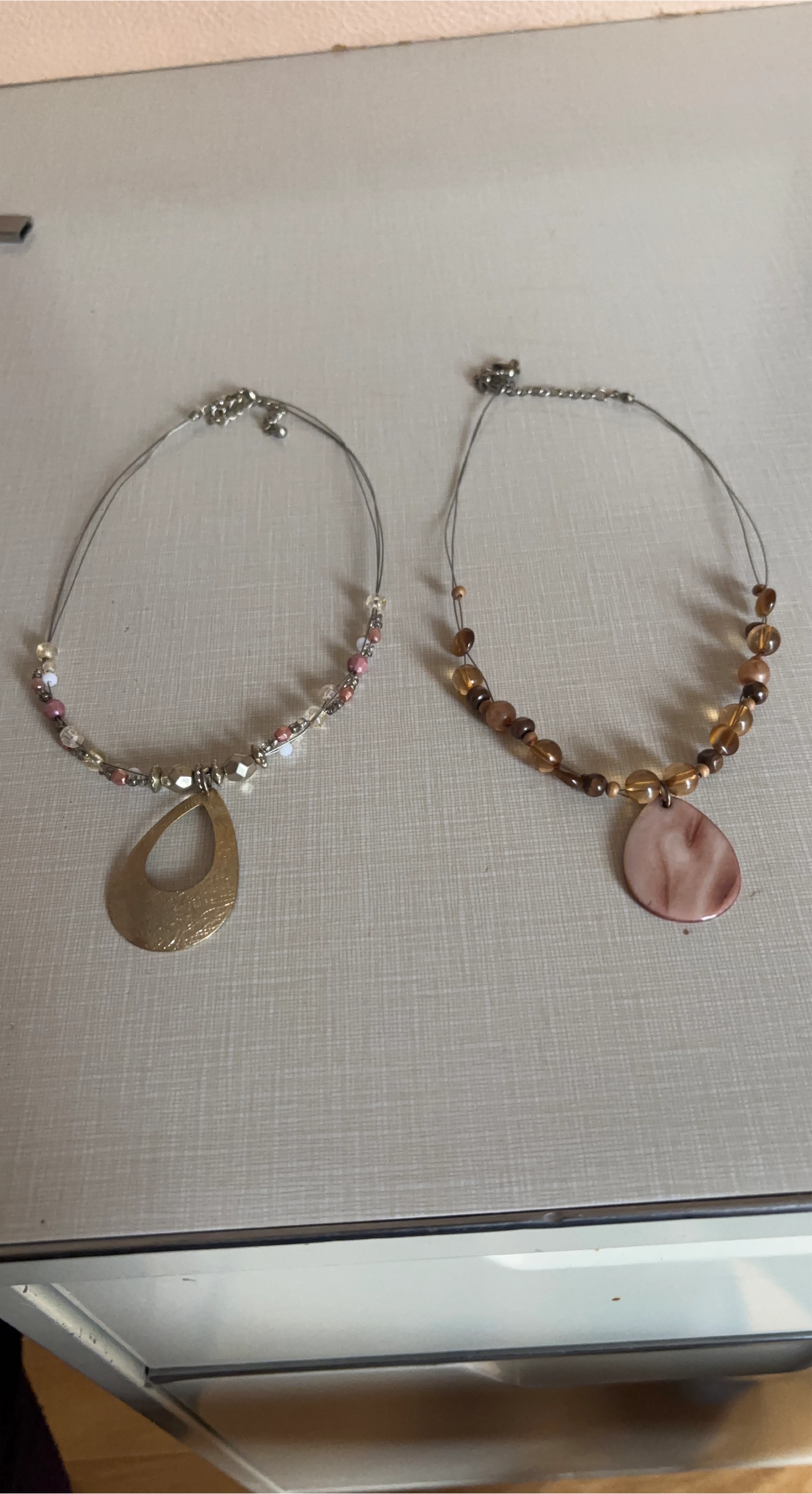 Two Beaded Necklaces with Pendants