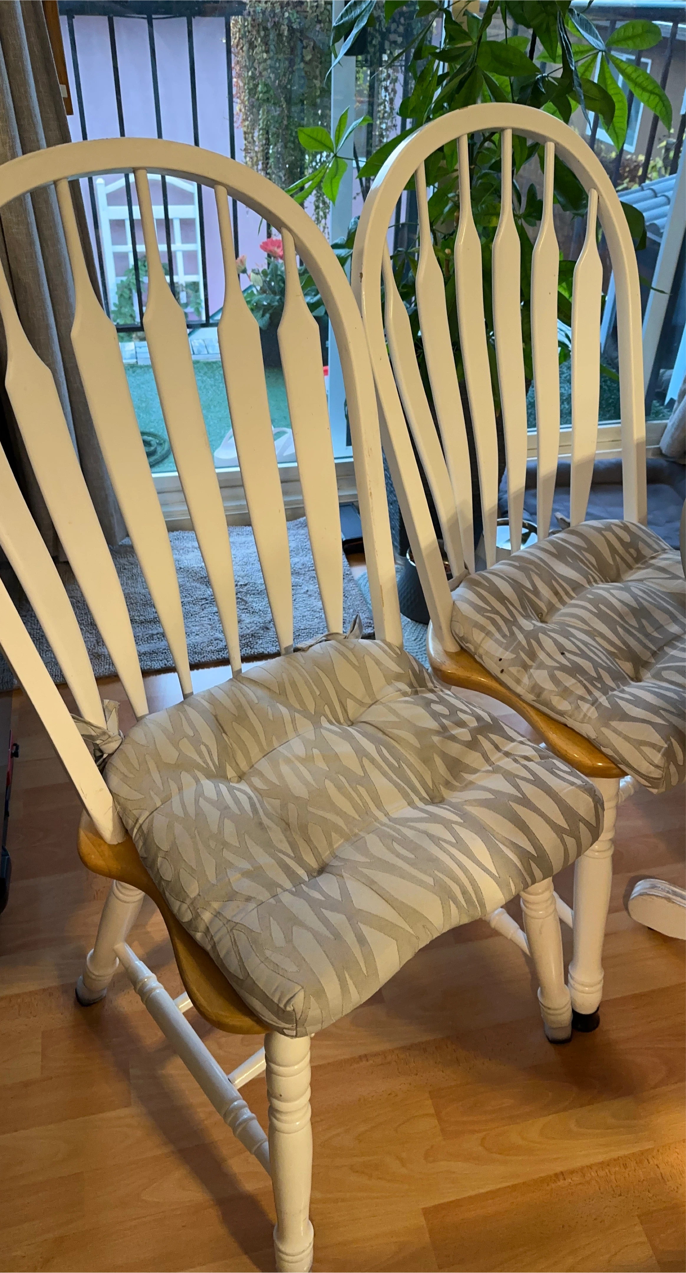 4 white wooden chairs