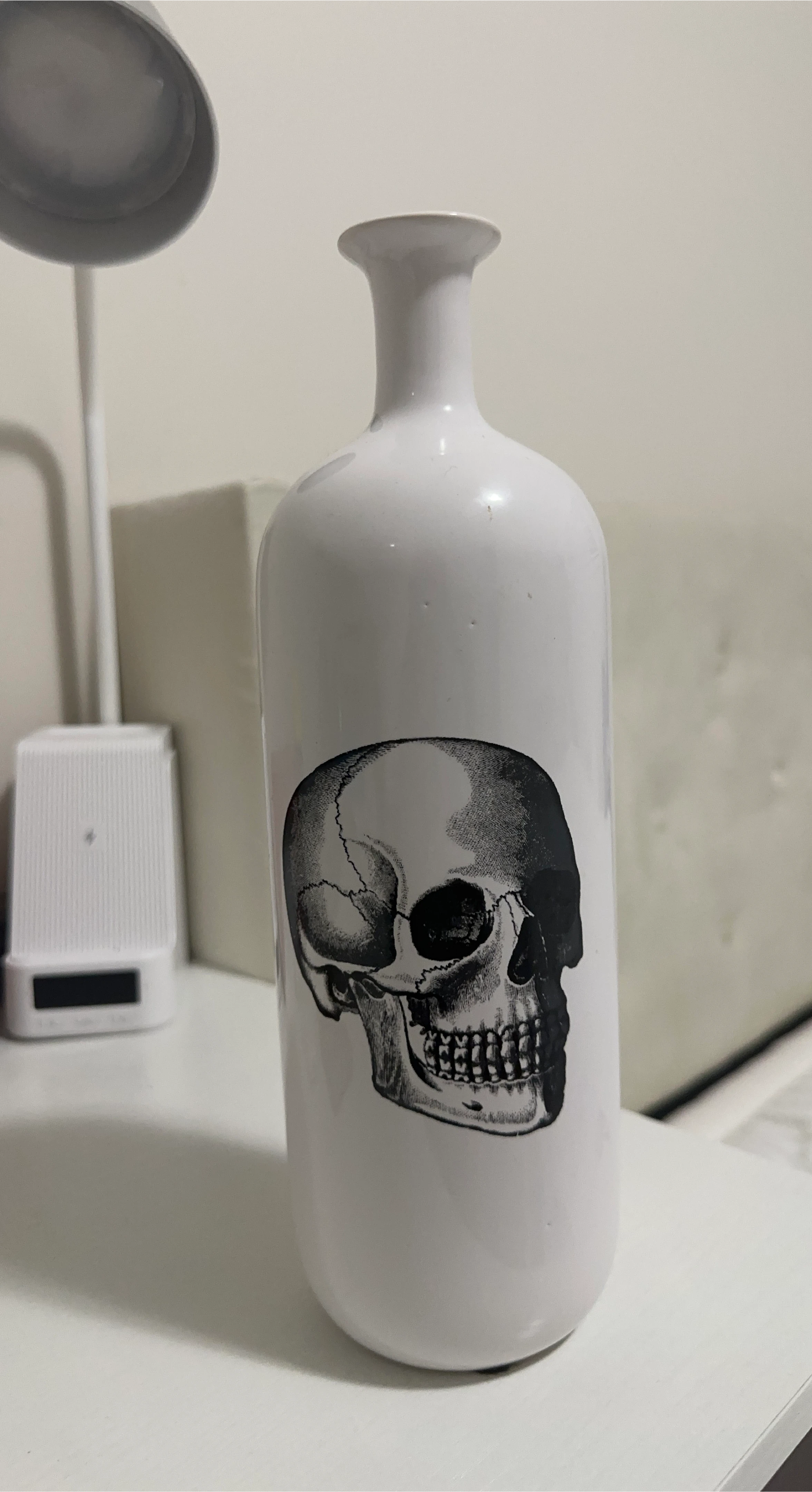 White Vase with Skull Design