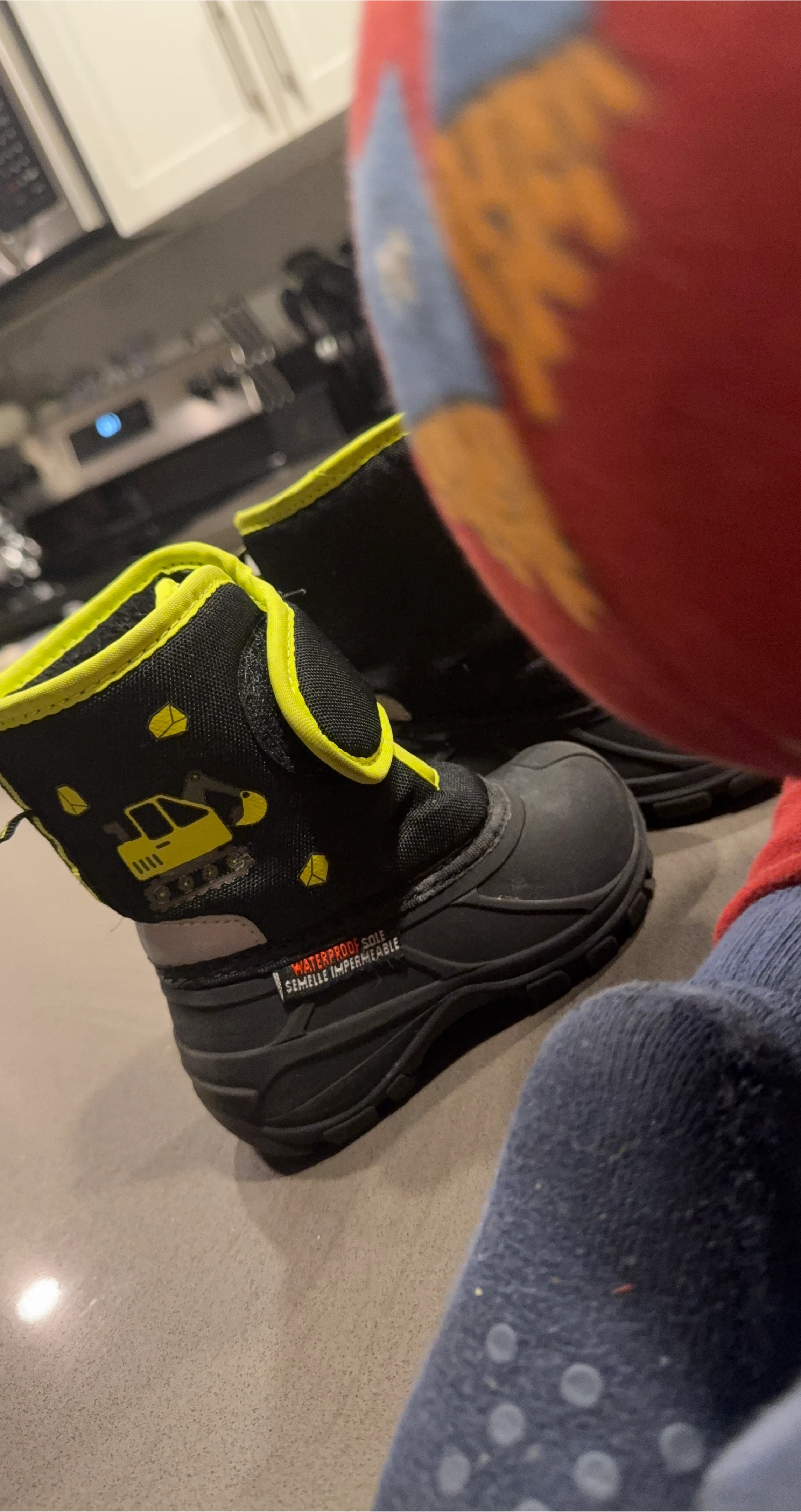 Black and neon yellow excavator winter boots