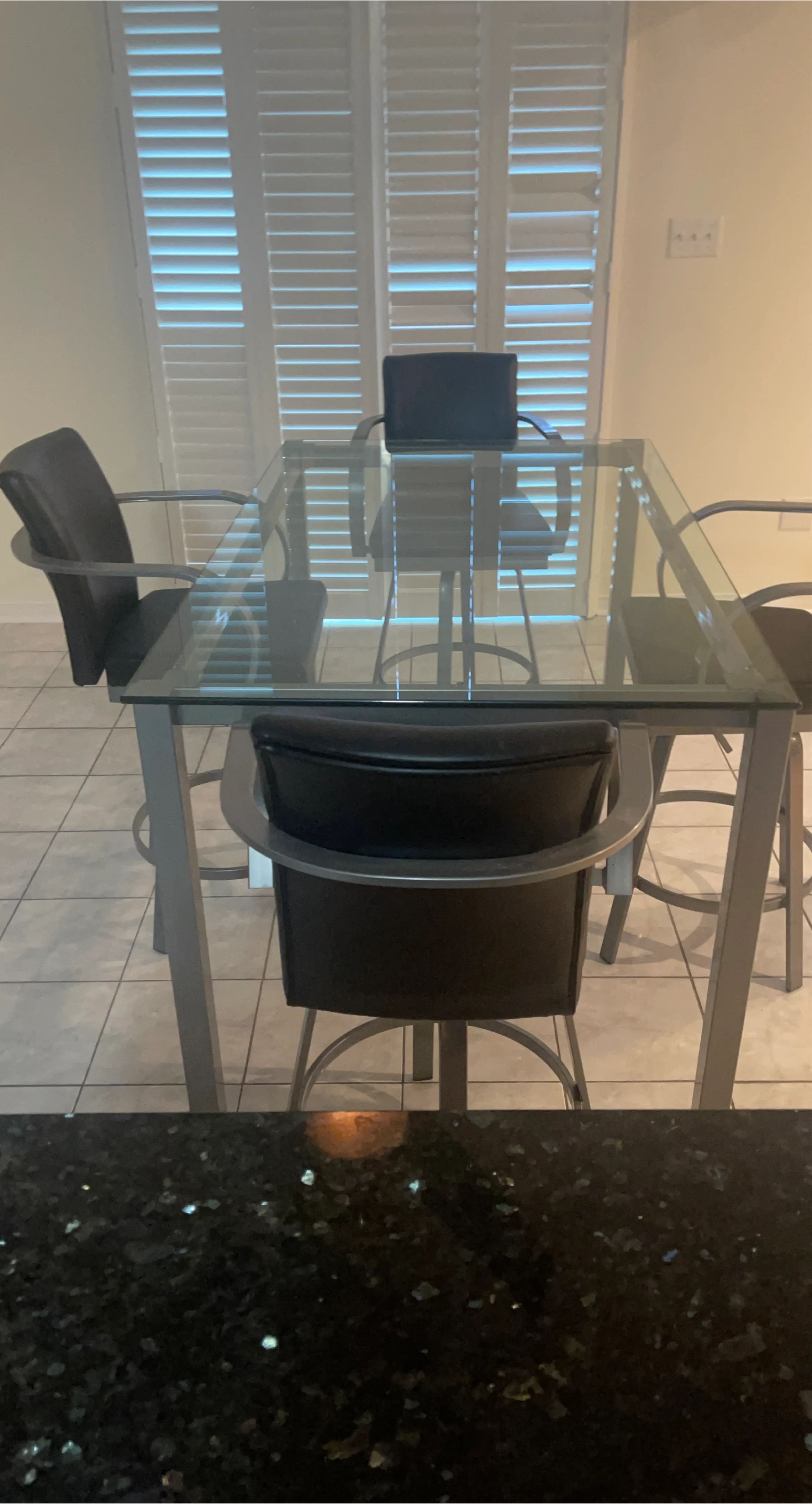Glass Dining Table with Four Swivel Chairs