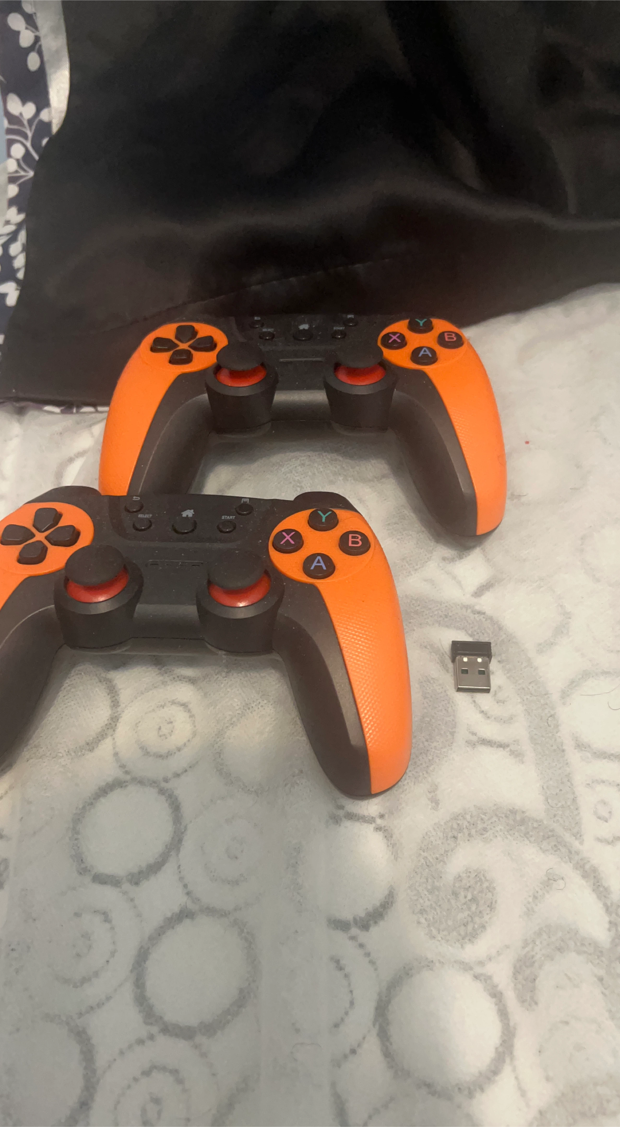 Orange & Black Wireless Game Controllers