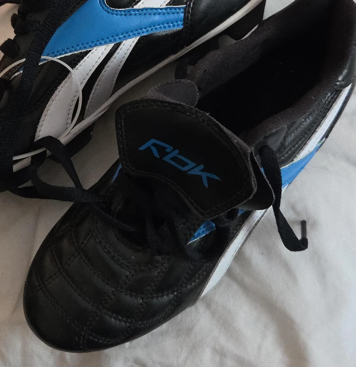 Reebok Black & Blue Cleats