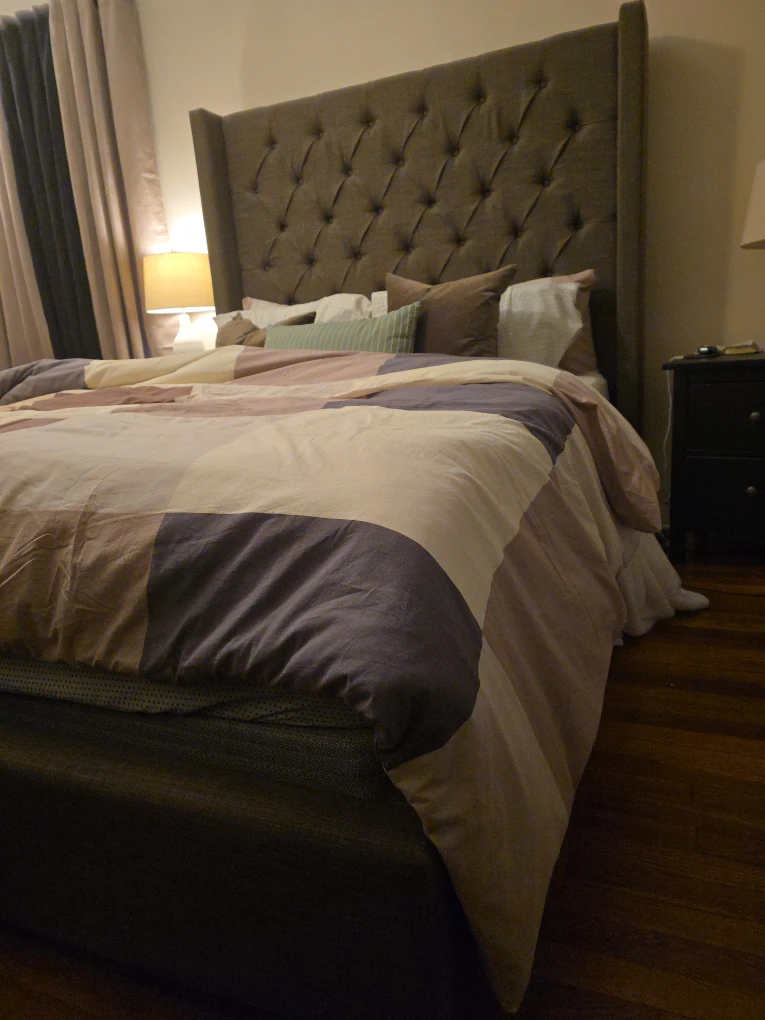 Bed with Upholstered Wingback Headboard