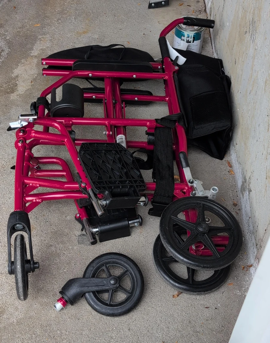 Folding Transport Wheelchair - Red one wheel broken