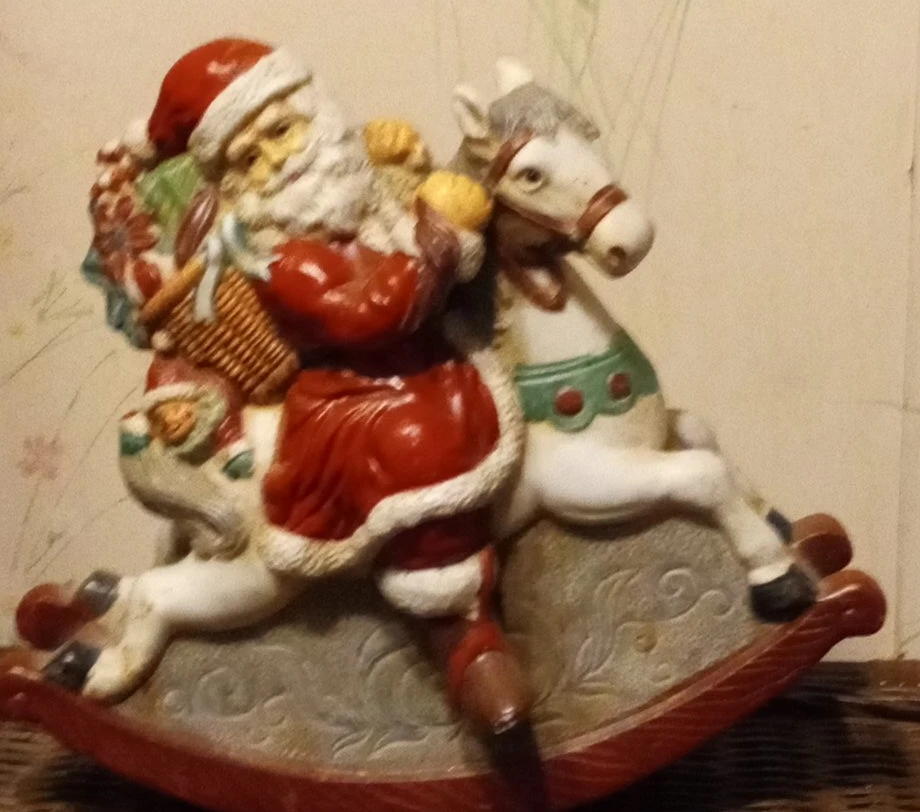 Santa Claus on Rocking Horse Figurine
