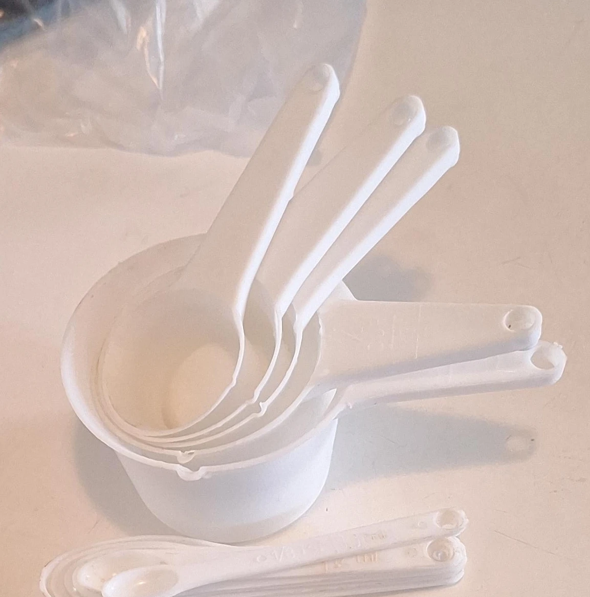White Plastic Measuring Cups and Spoons Set