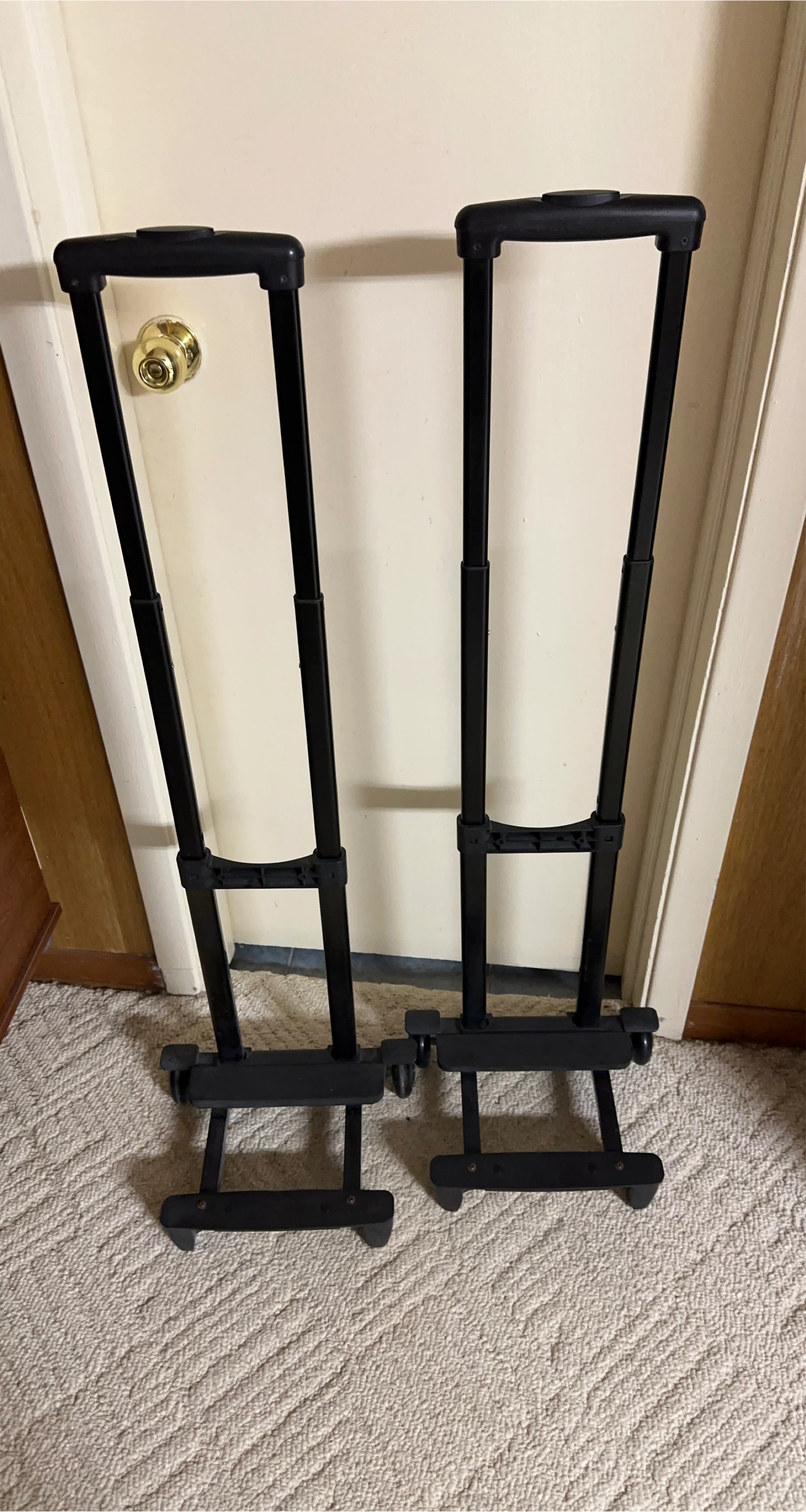 Two Black Rolling Suitcase Handles
