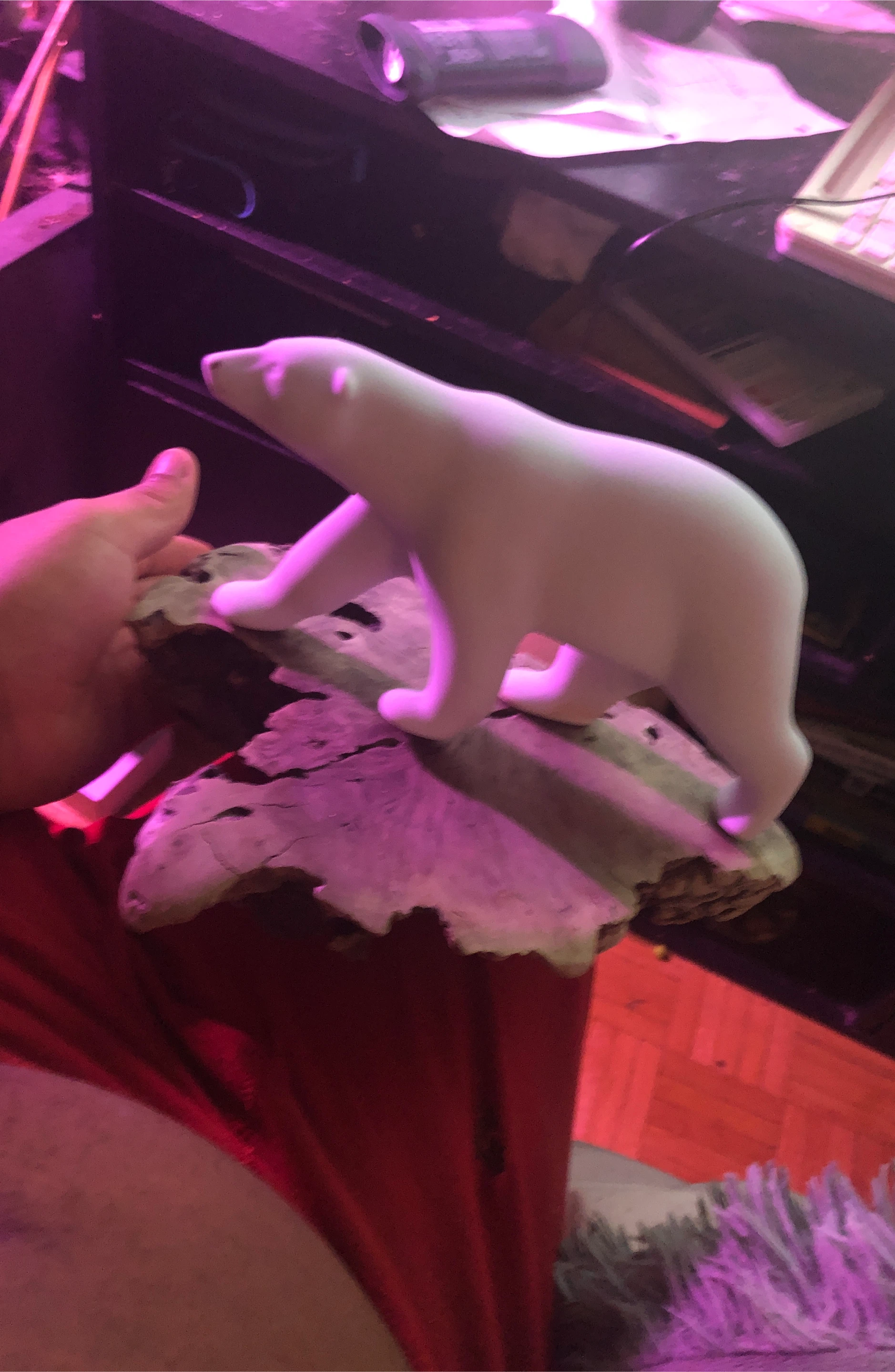 White Polar Bear Sculpture on Driftwood Base