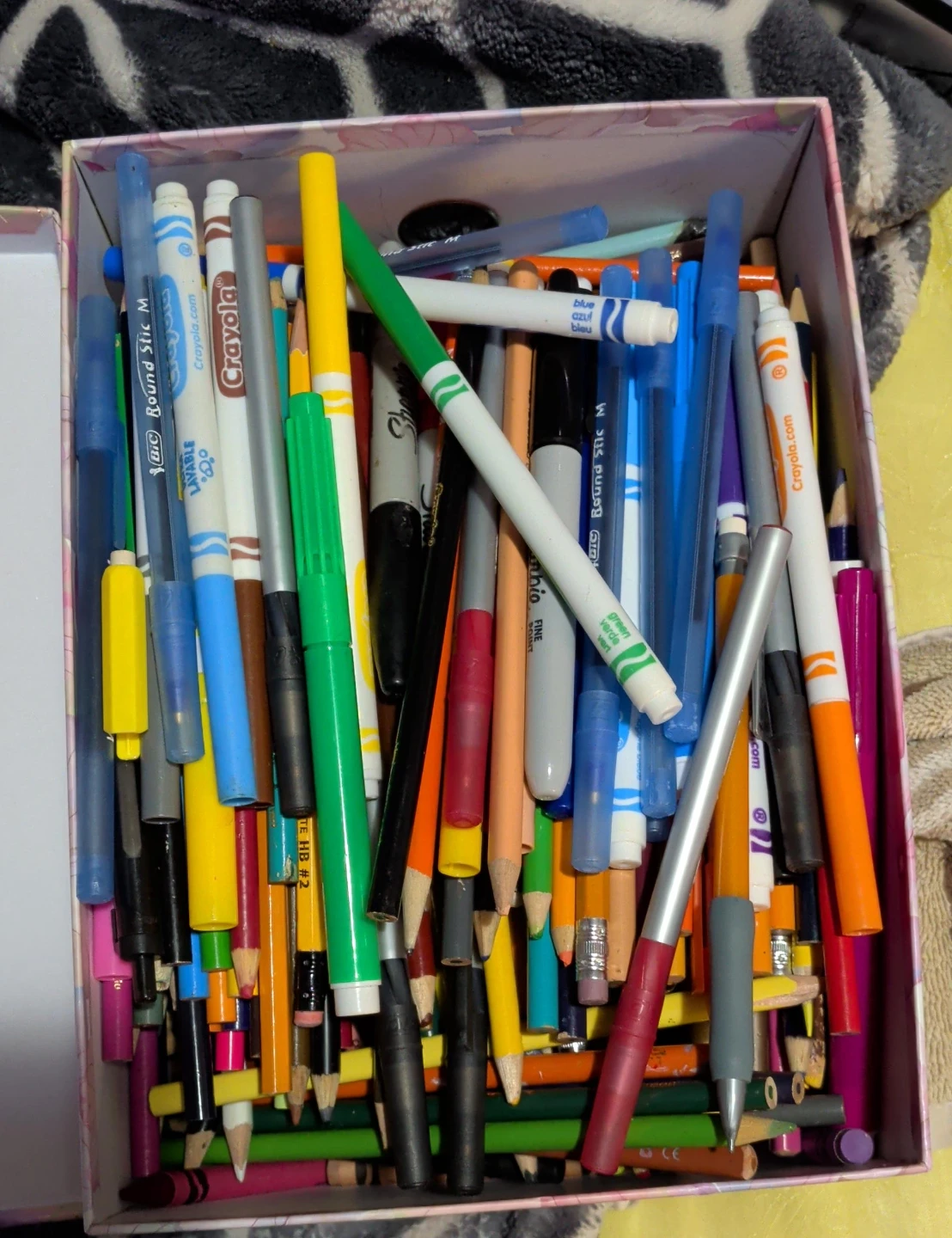 Box of assorted pens and pencils