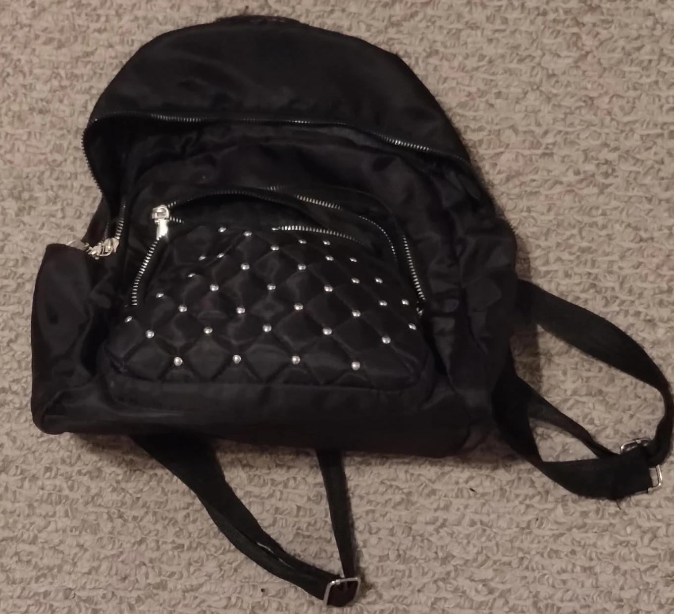 Black backpack with studded detail