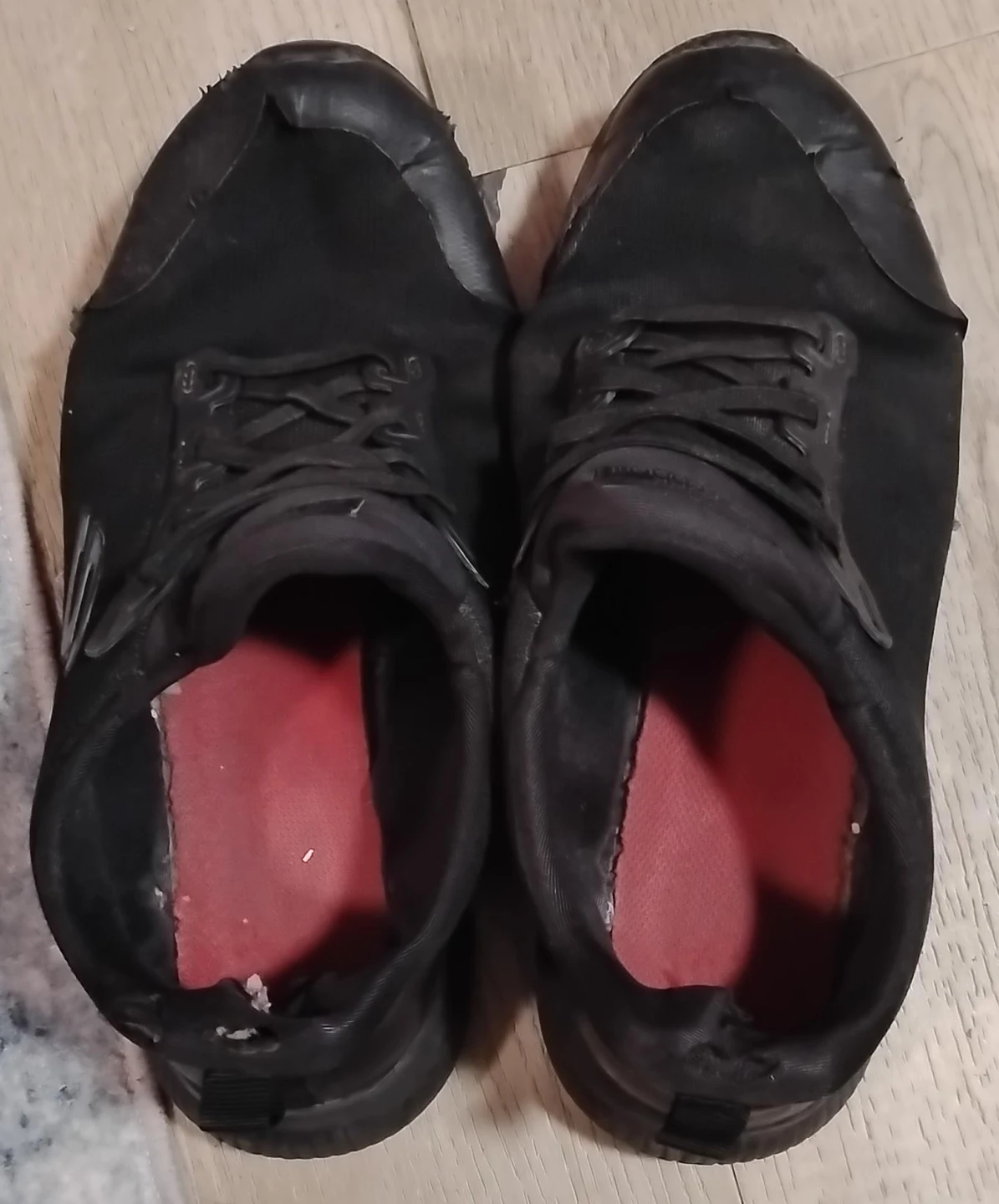 Worn Black Running Shoes