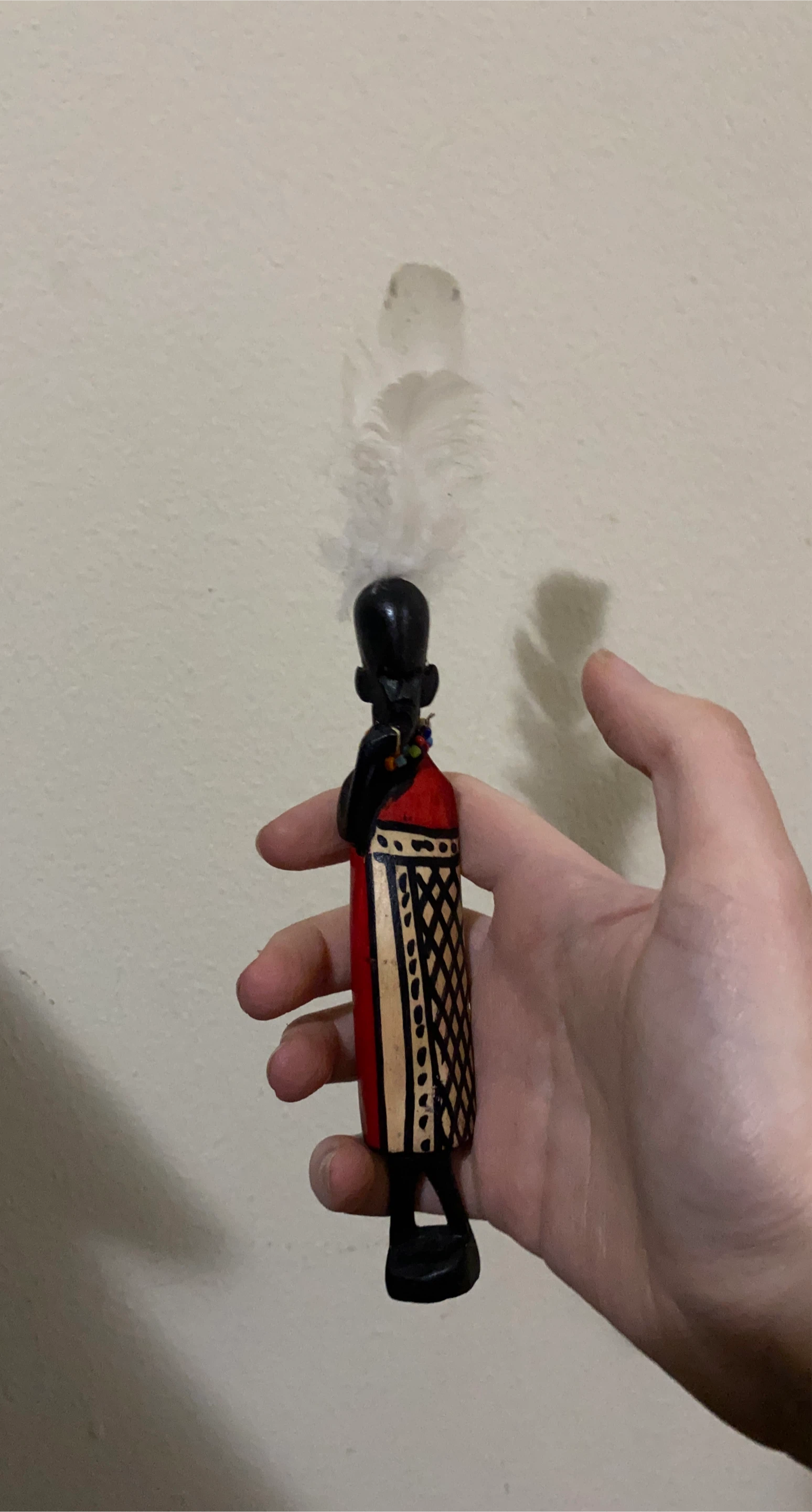 African Wooden Figurine with Feather