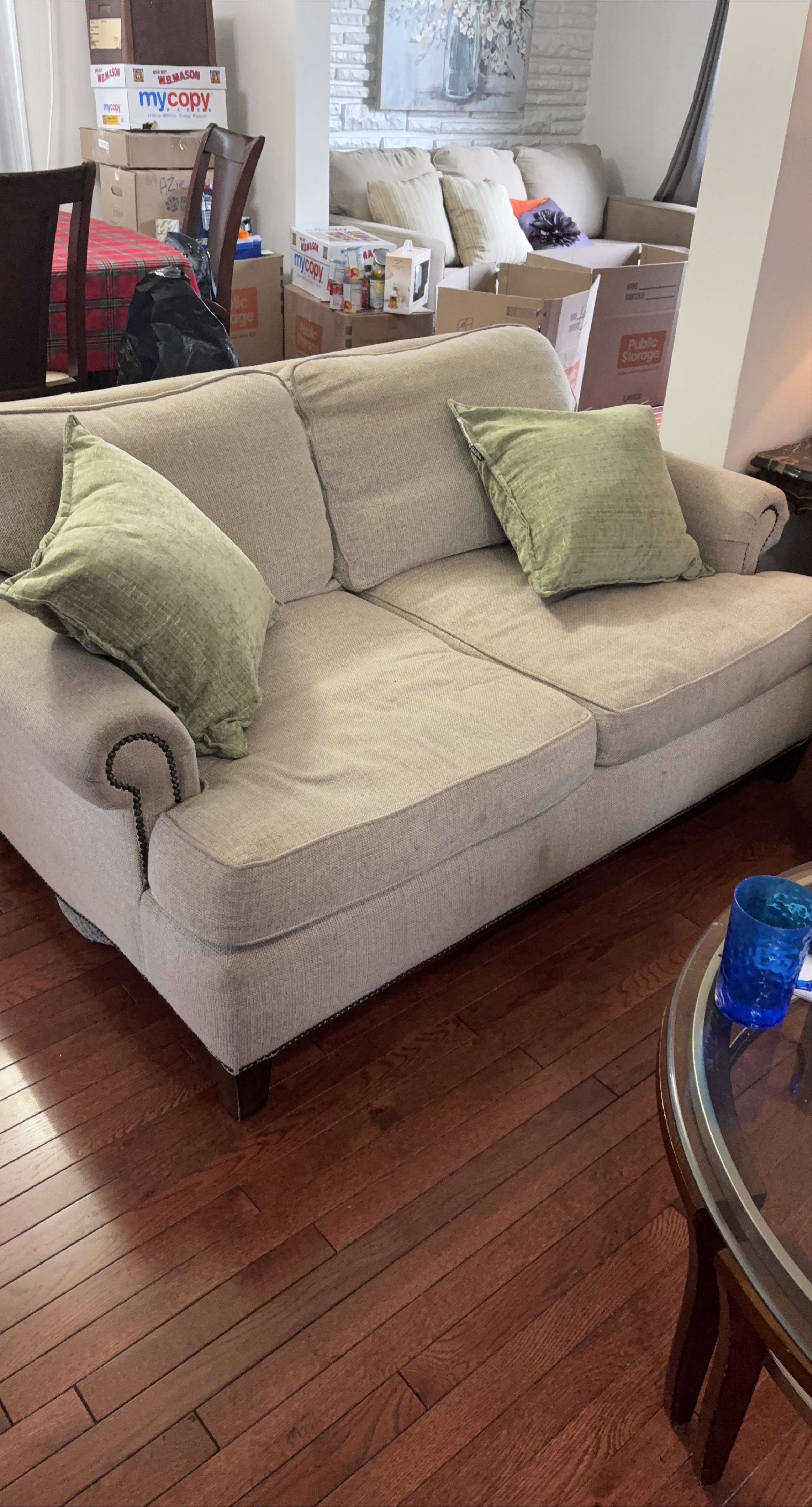 Comfortable Beige Sofa with Green Pillows