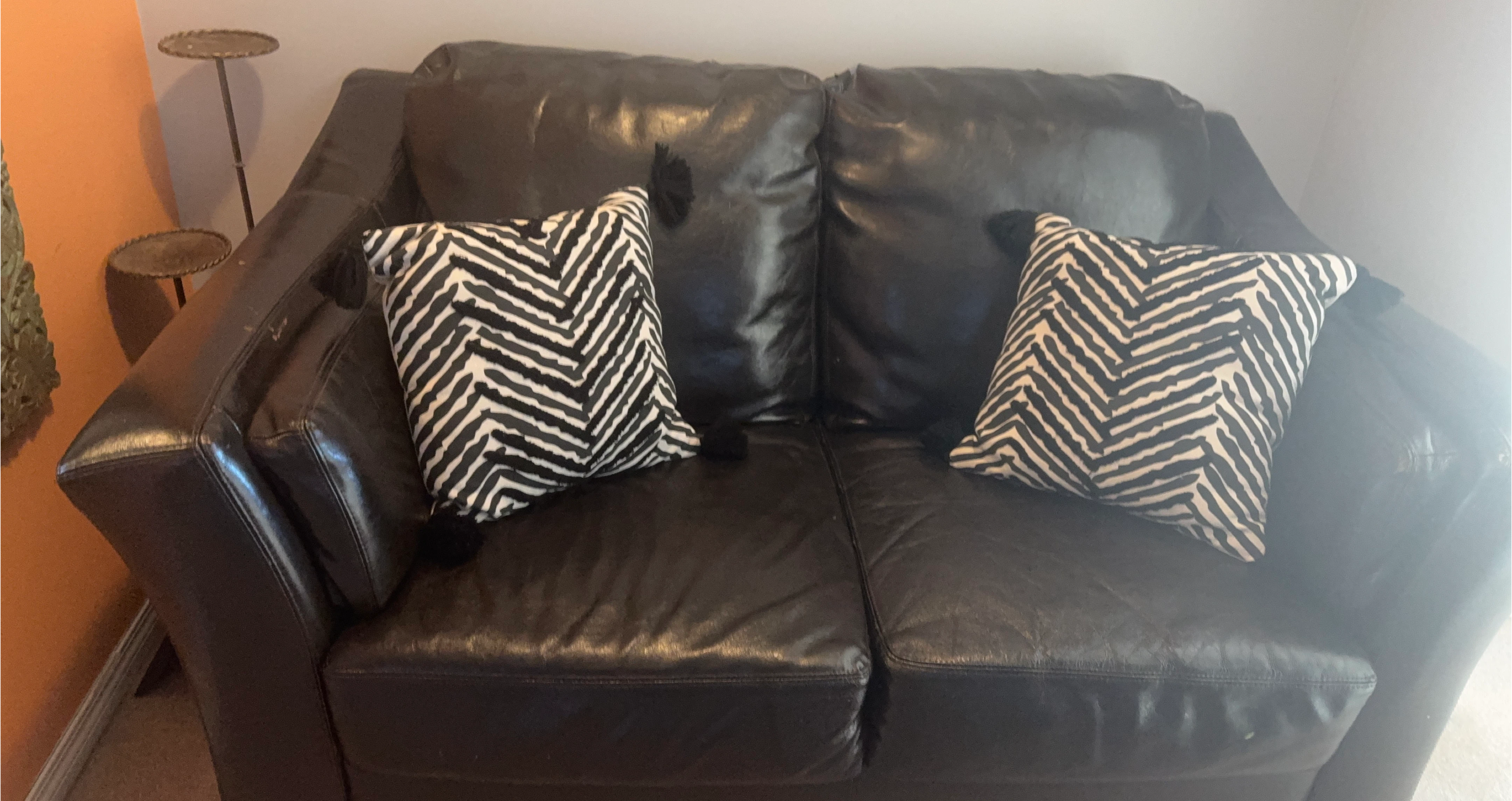 Black Leather Loveseat with Pillows