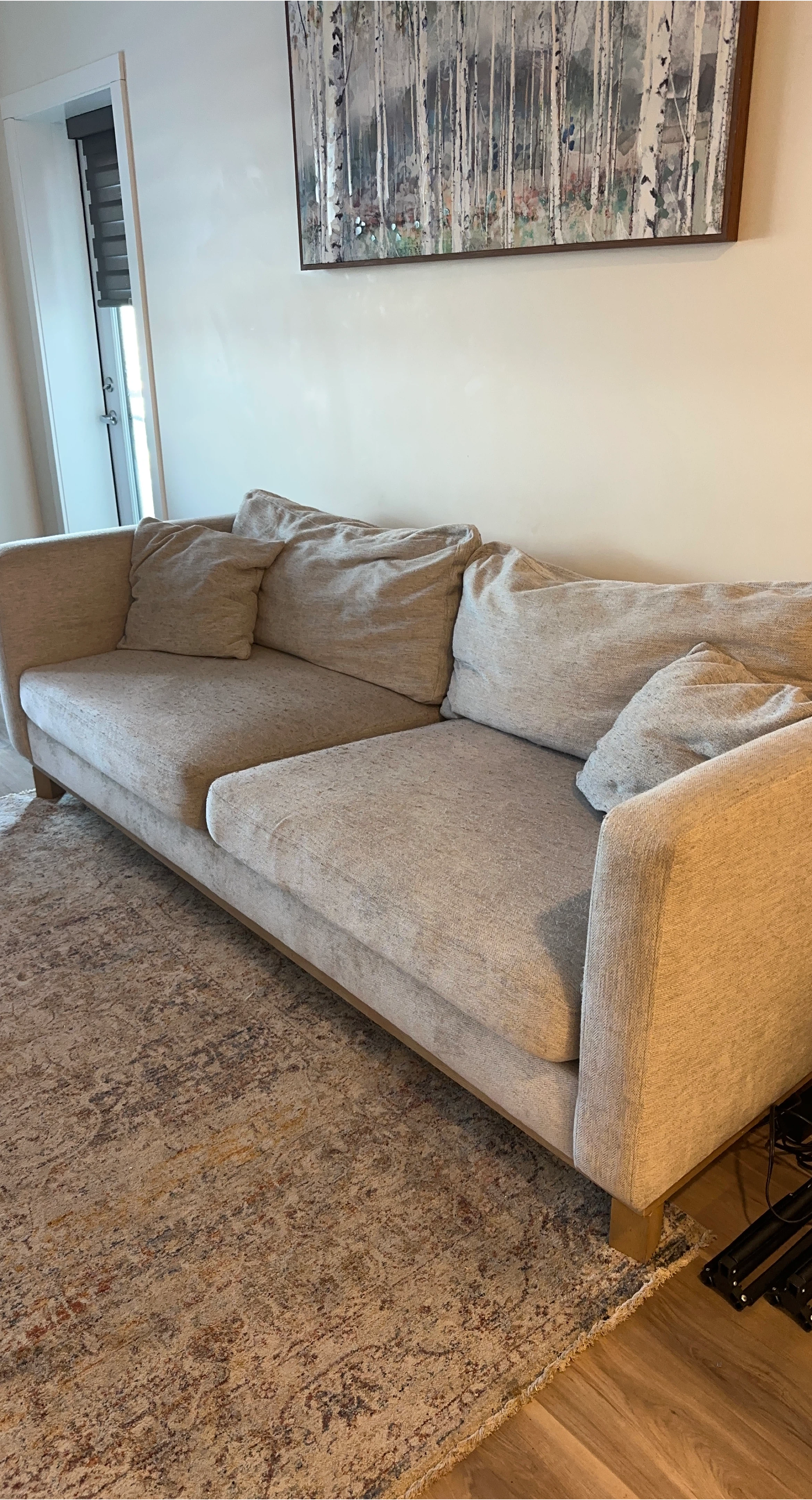 Light Beige Upholstered Sofa with Pillows