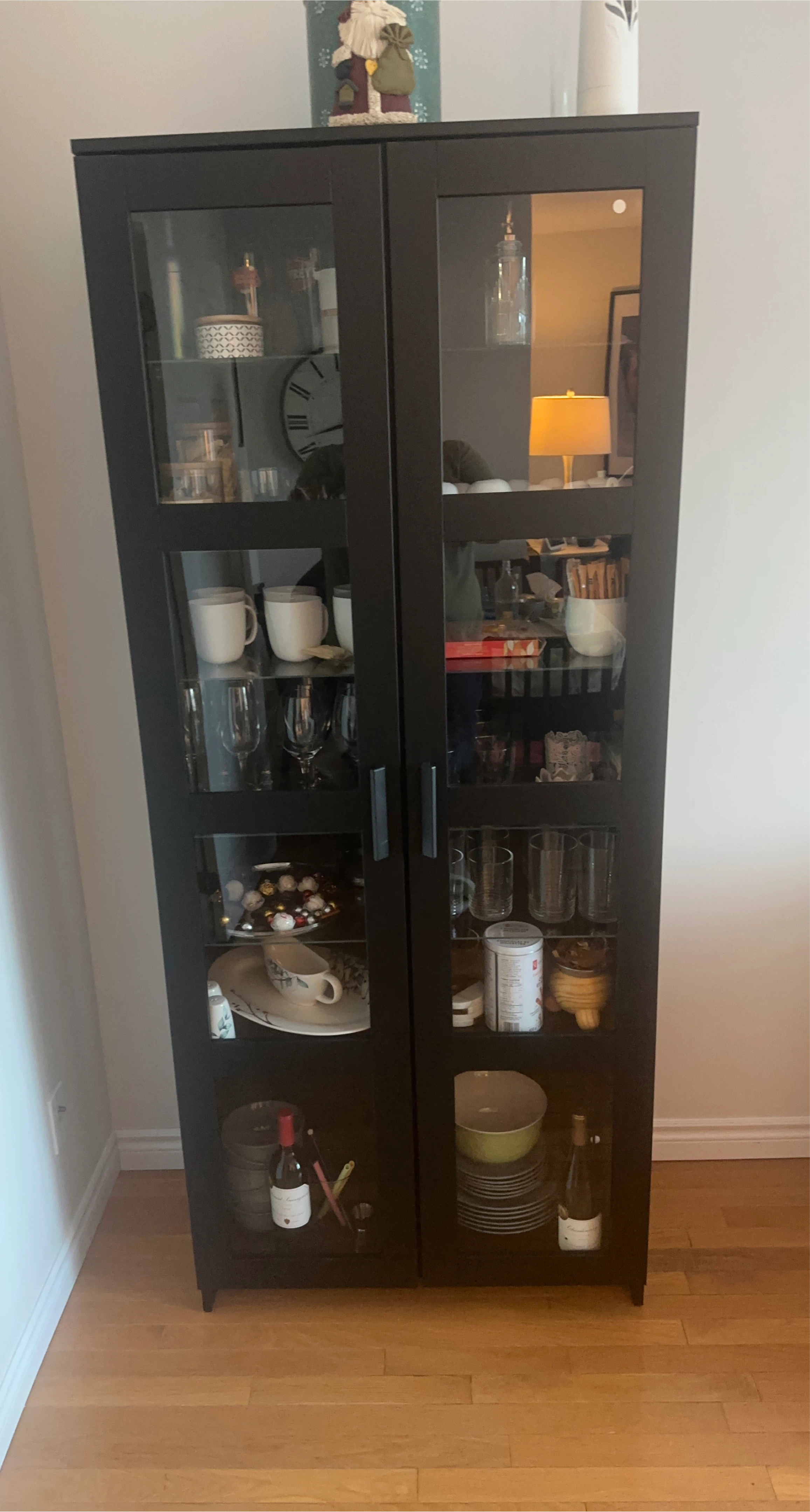 Black display cabinet with glass doors