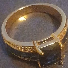 Gold Finish Ring with Dark Stone